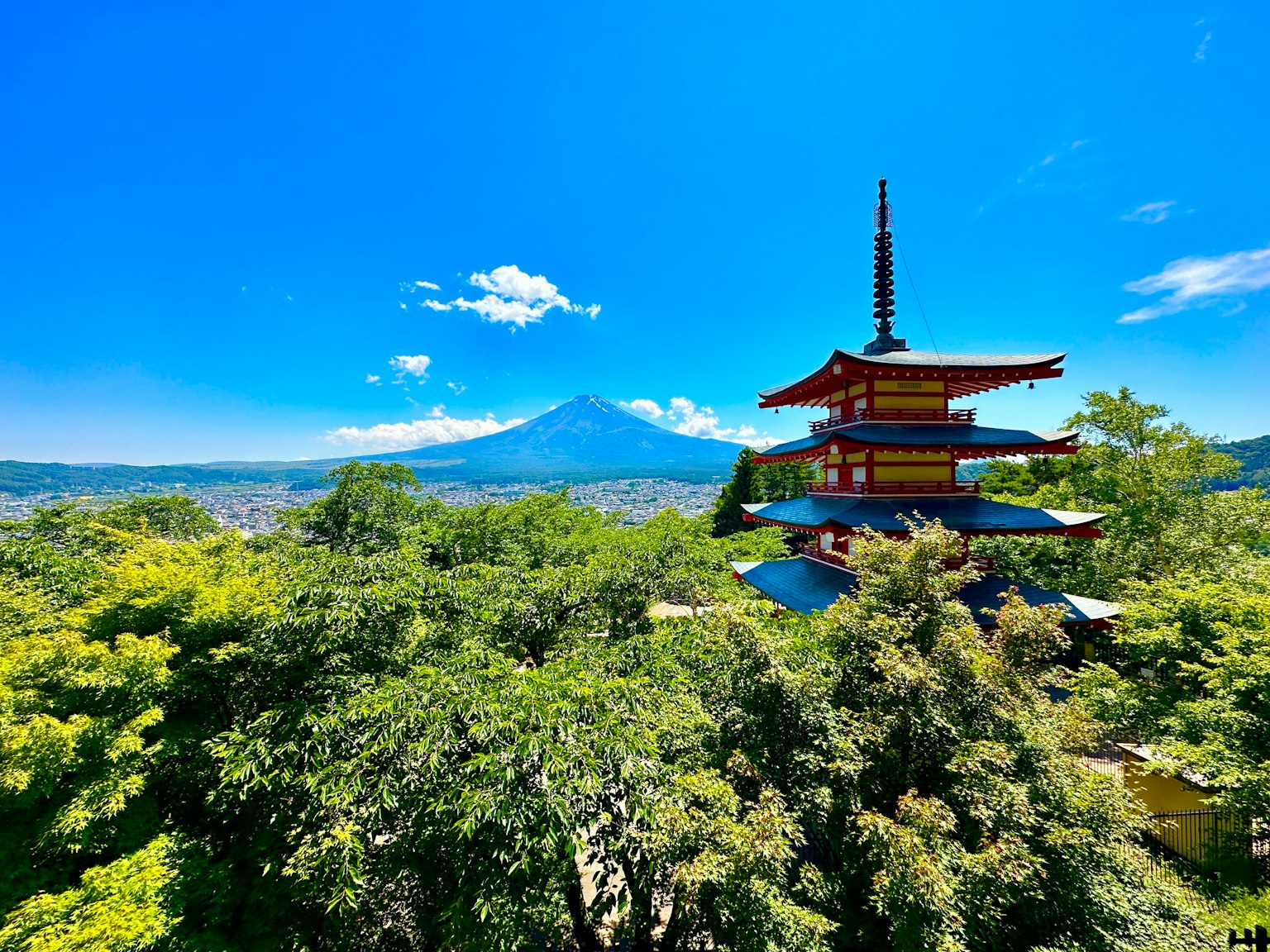 Stunning five-story pagoda with Mount Fuji in the background and clear blue sky