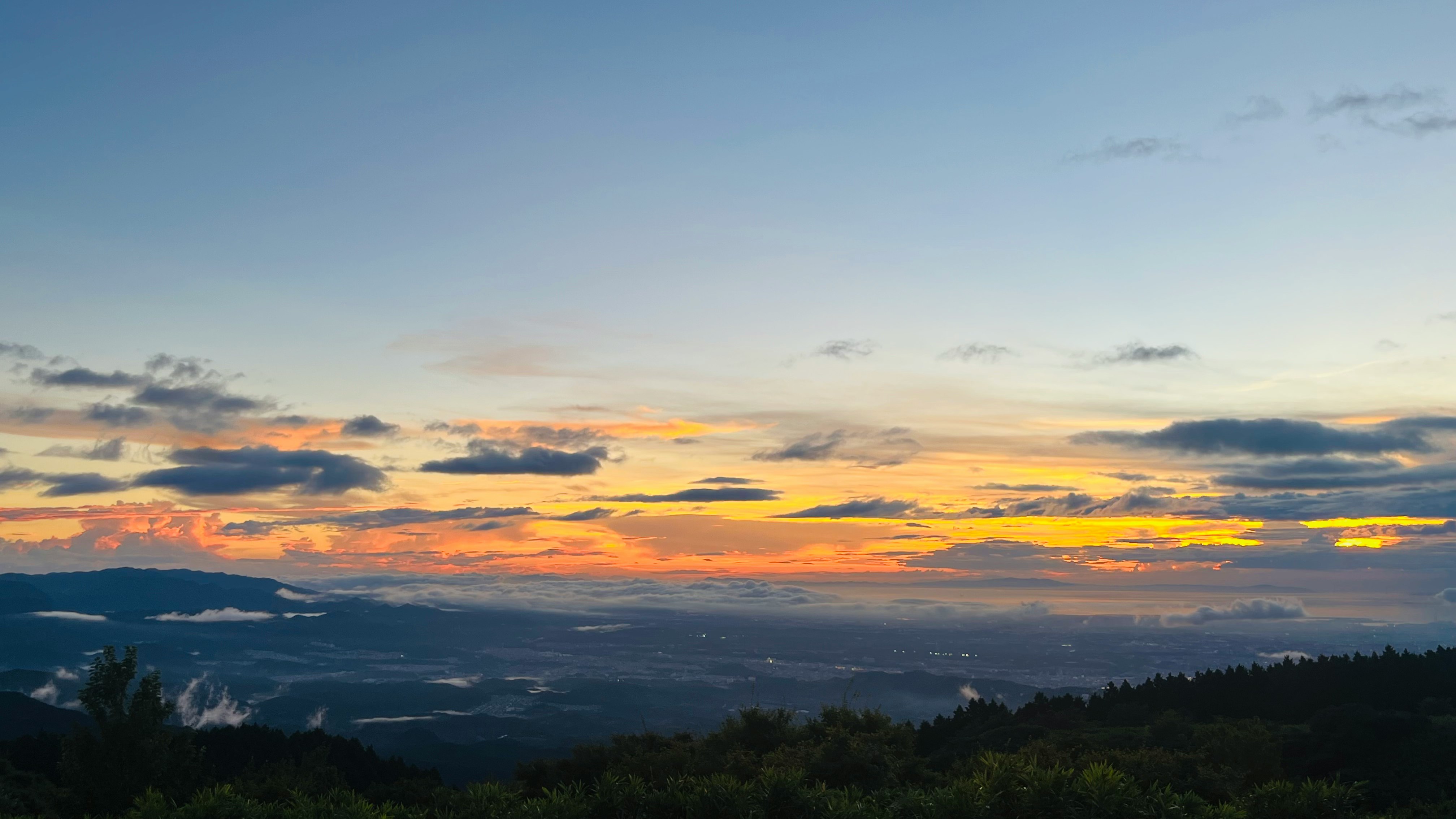 sunset sky over distant mountain ridges