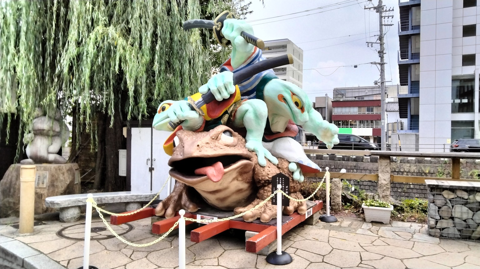 Art sculpture of a yokai riding on top of a frog