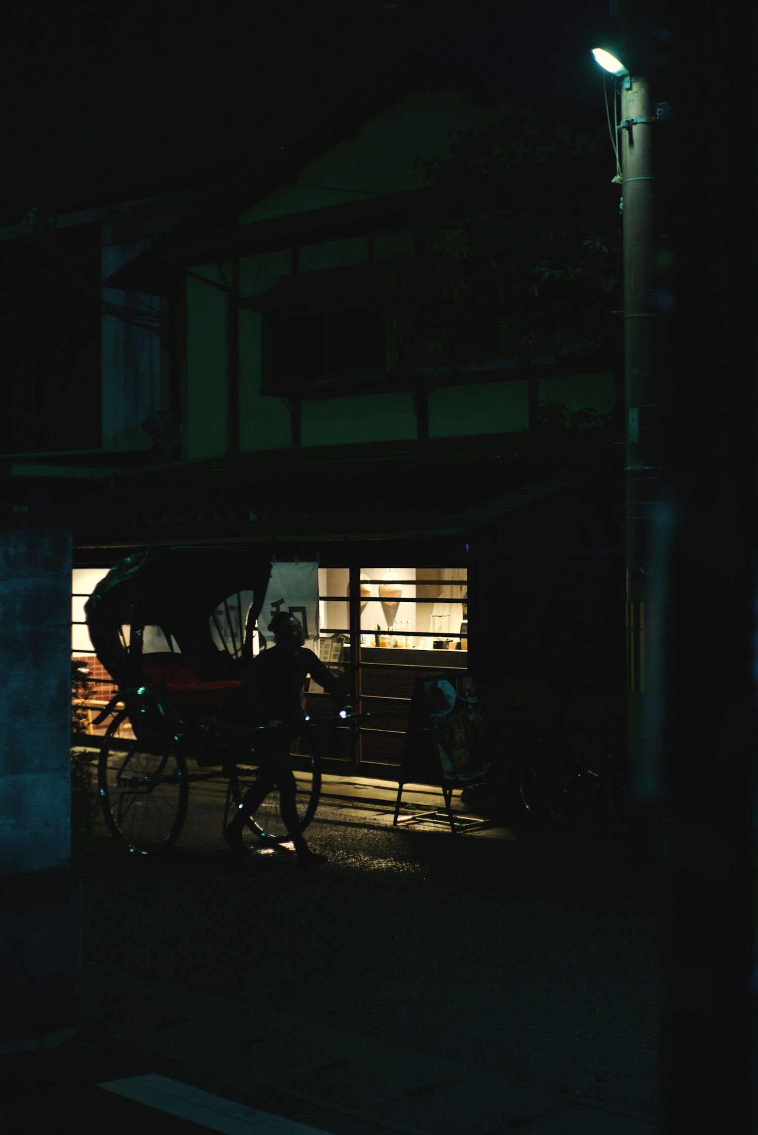 A rickshaw parked in a nighttime street scene Soft warm lighting creates a cozy atmosphere