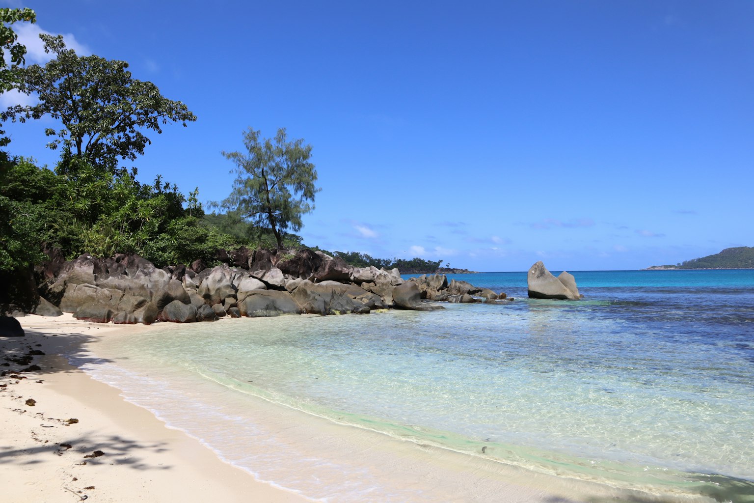 Scenic beach view with clear water and blue sky