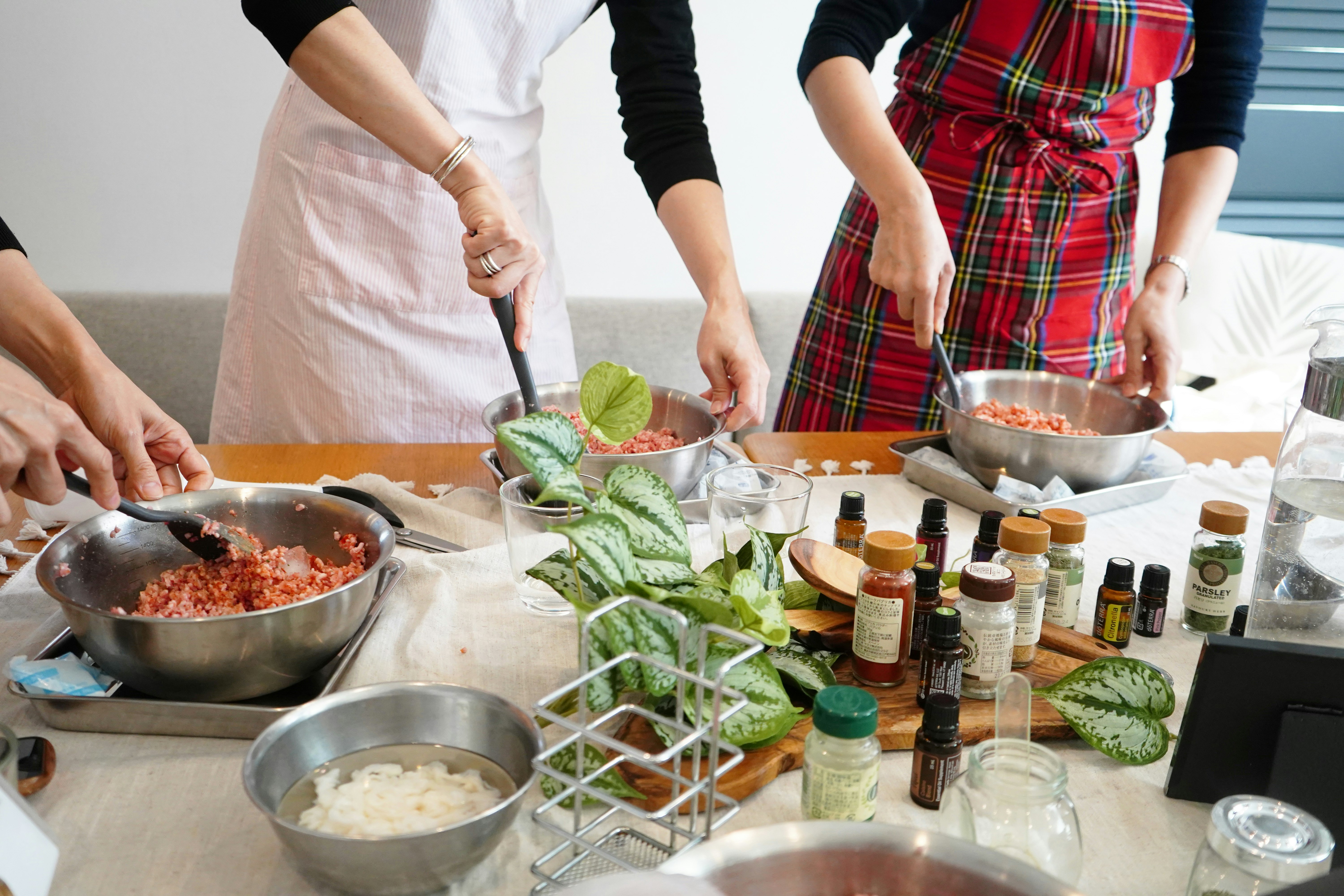 cooking class table with chopped vegetables and arranged spices