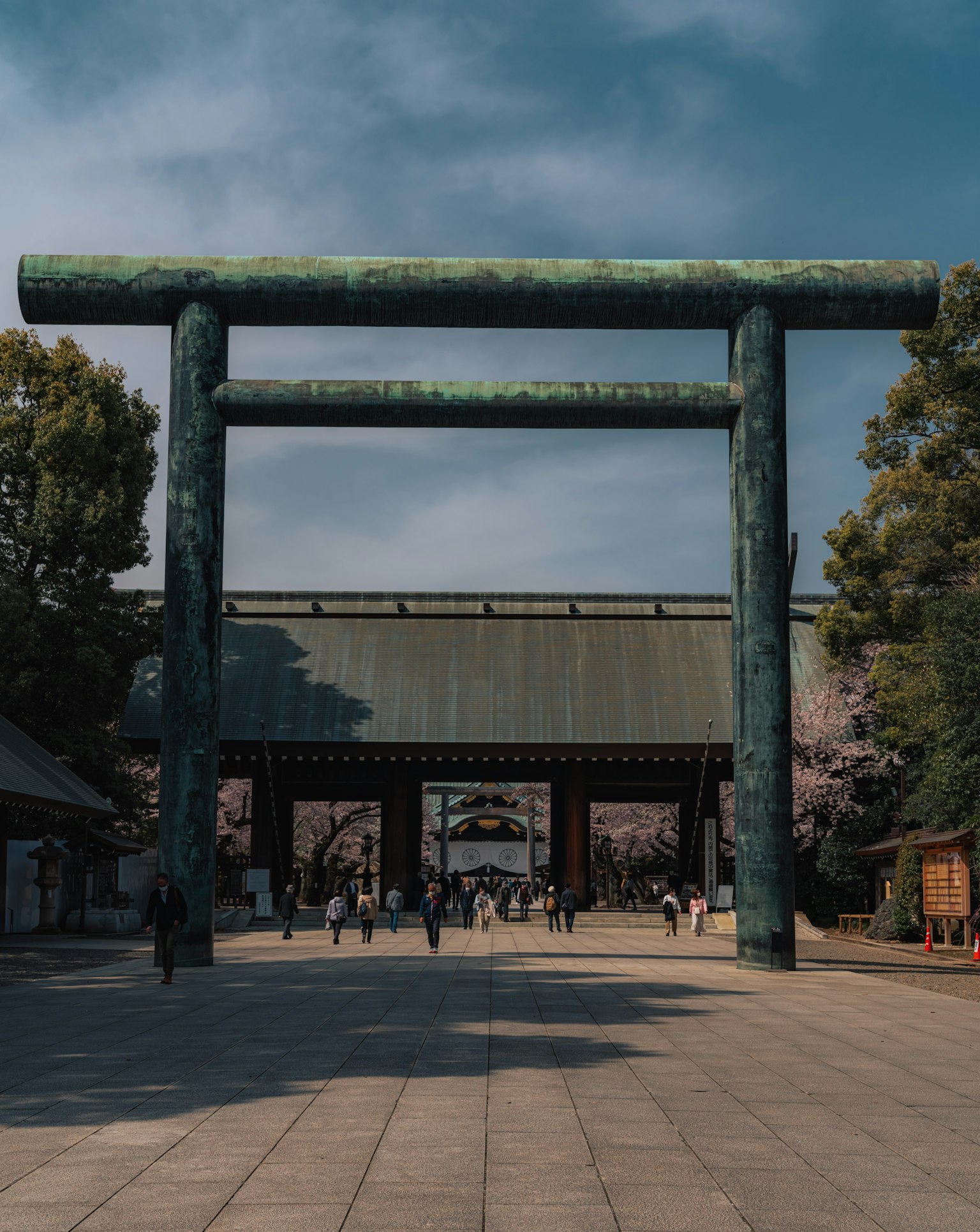 Large torii gate at the entrance of a shrine under a blue sky