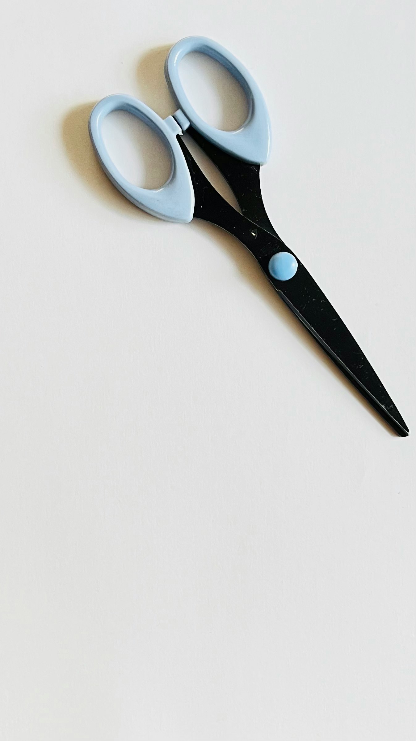 blue scissors on a white background