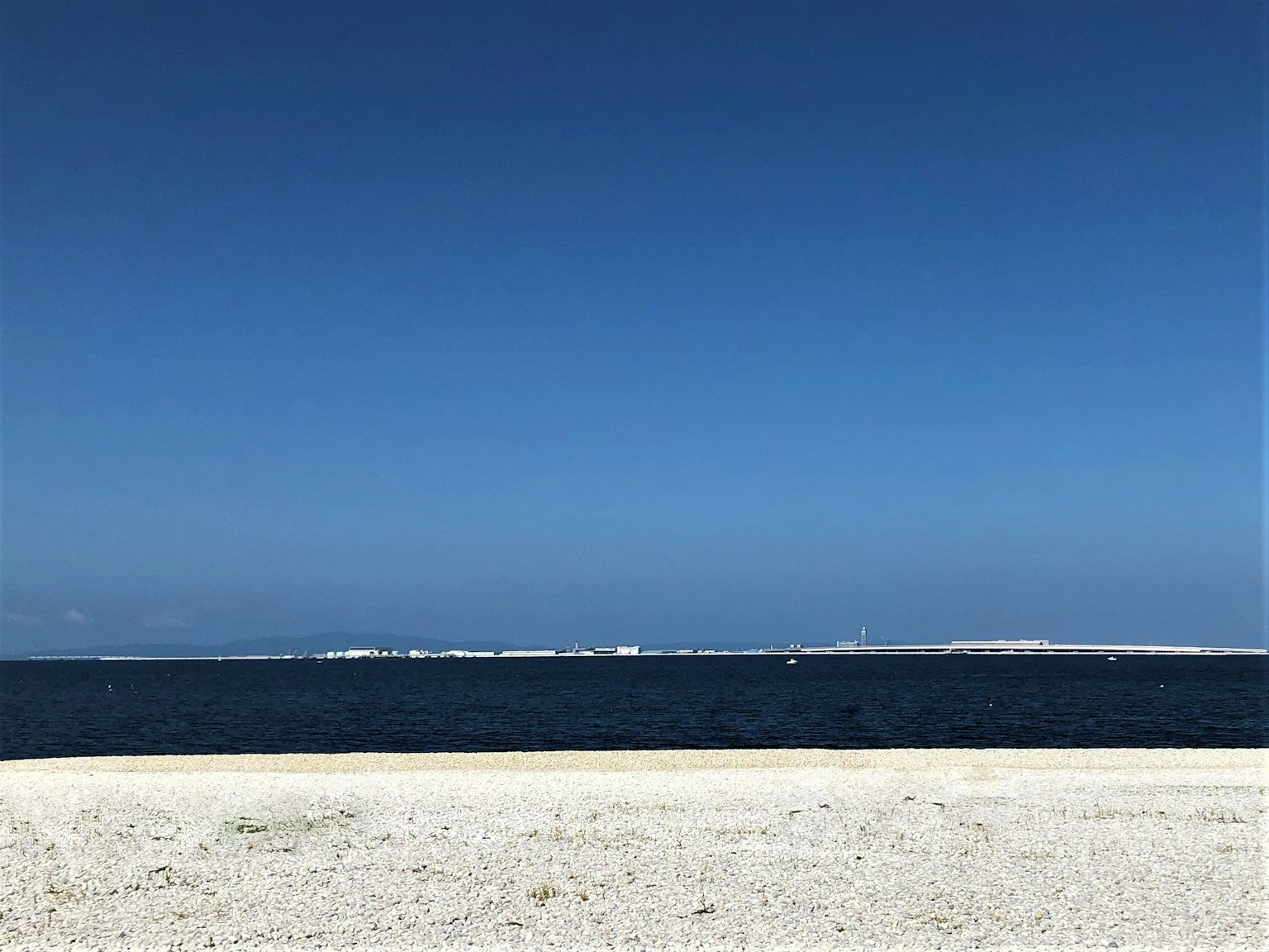 Beautiful landscape of blue sky and sea with wide white sandy beach