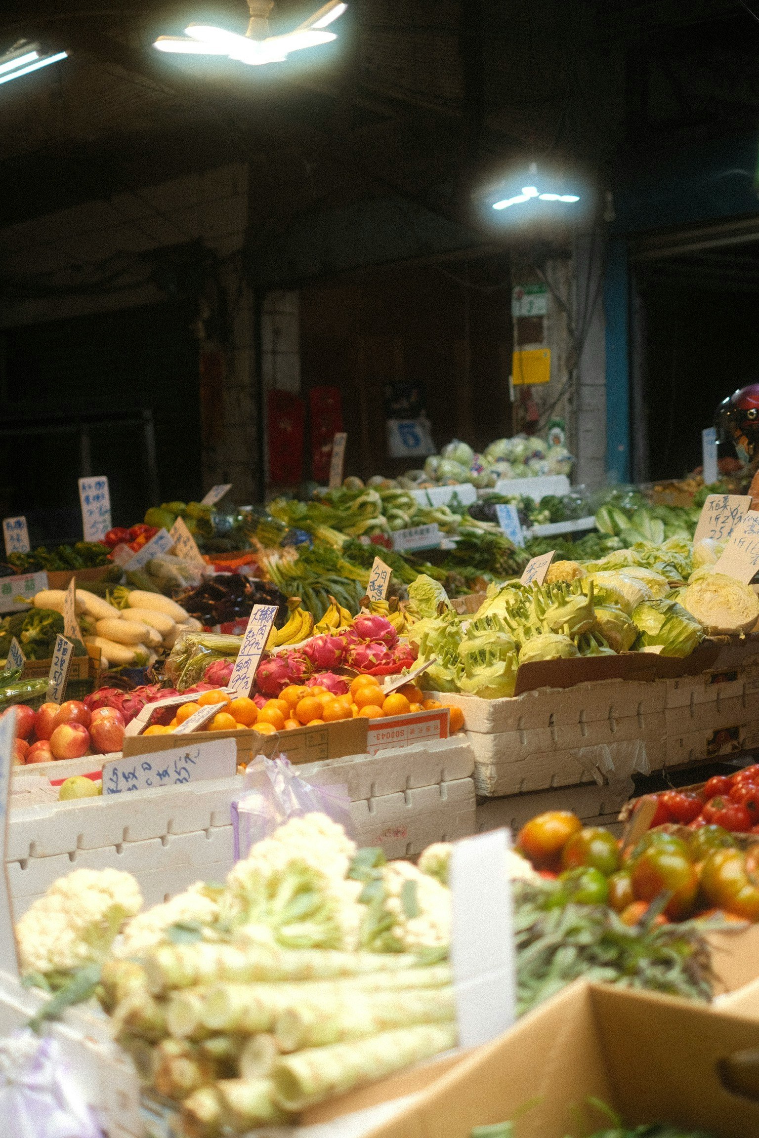 Taiwan street market produce stall with fresh vegetables and fruit