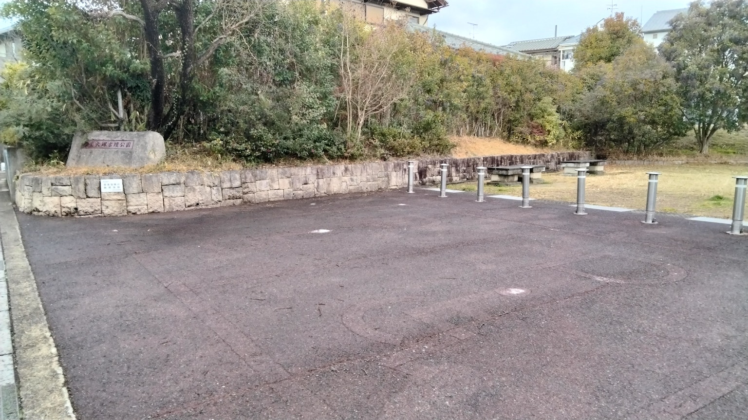 Spacious parking area with surrounding greenery