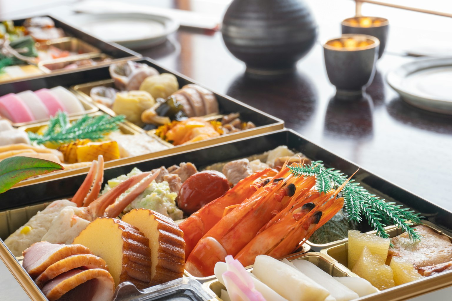 Colorful sushi and sashimi arranged on a traditional Japanese bento box