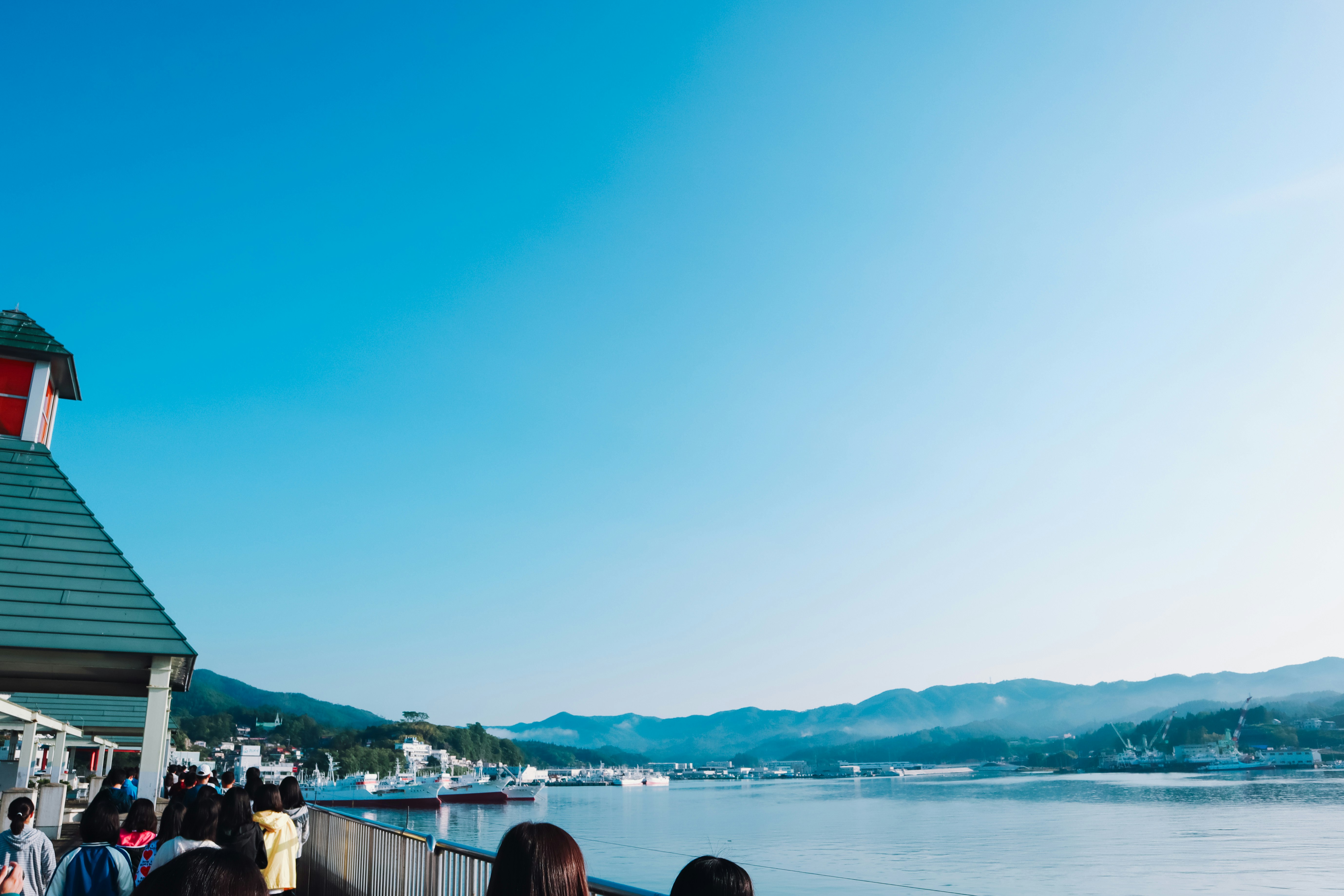 blue-sky waterfront view with a harbor quay