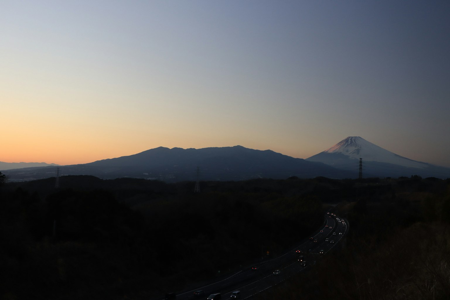 Beautiful landscape of Mount Fuji at dusk with surrounding mountains