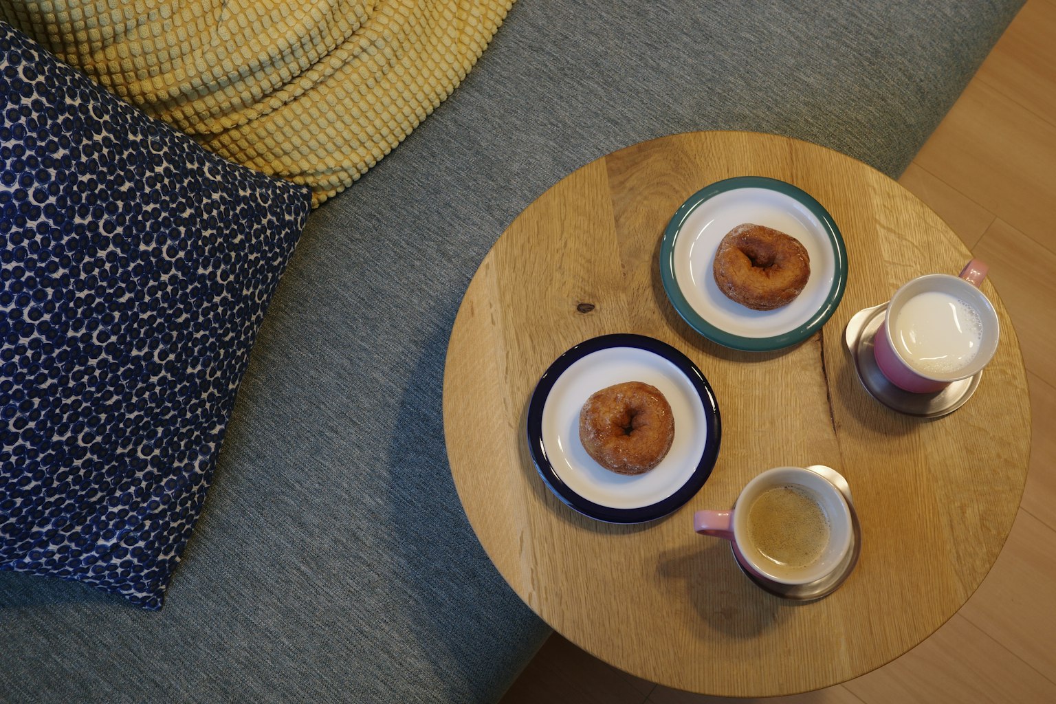 Image of donuts and drinks on a wooden table