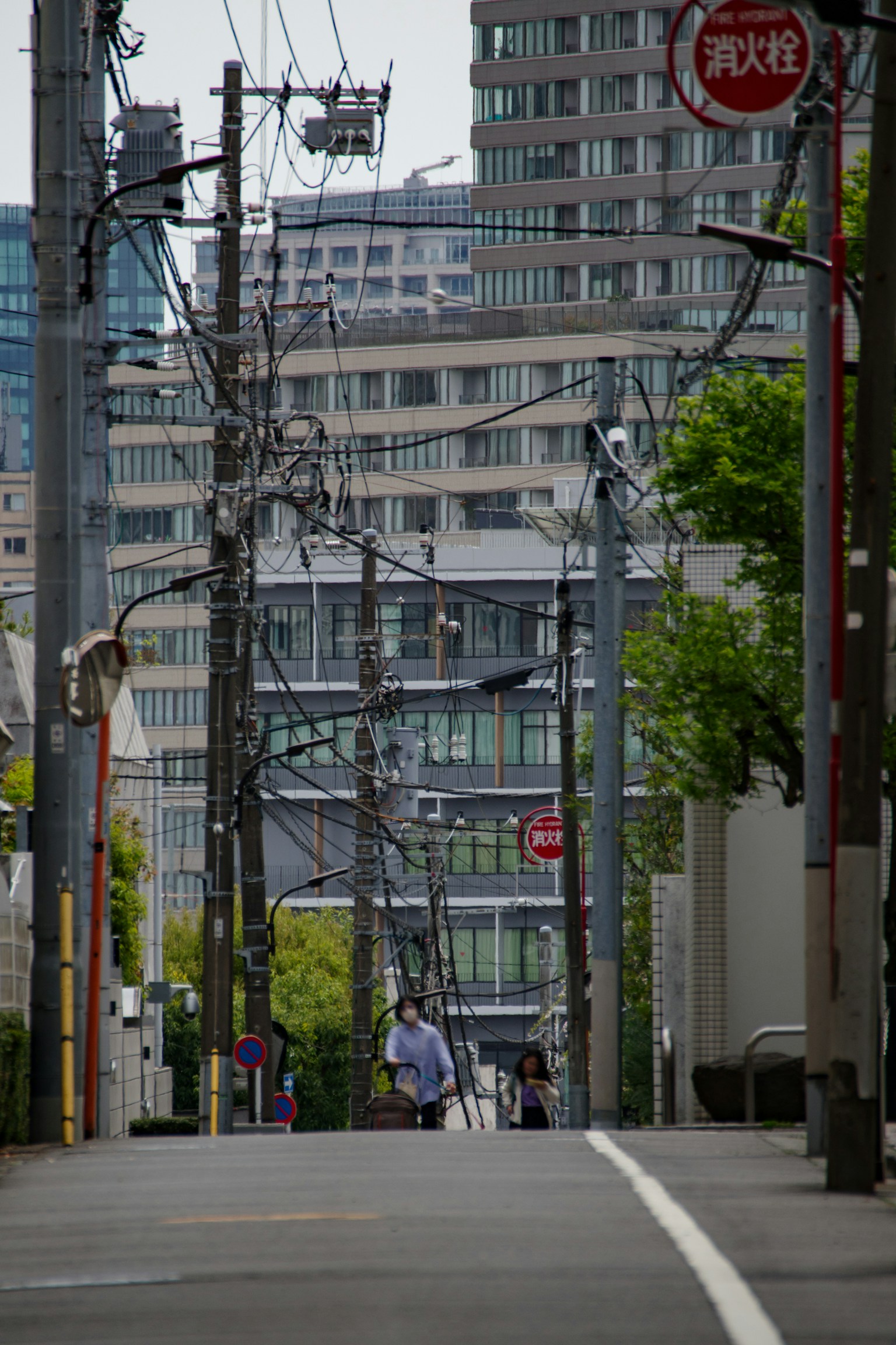 Urban street view with utility poles and buildings