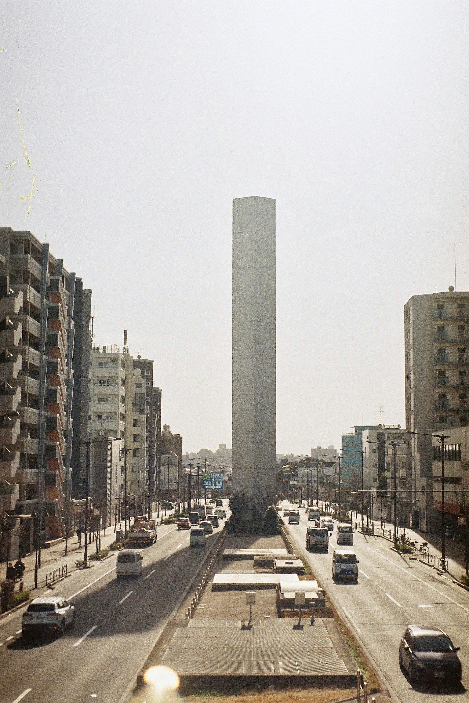 Urban landscape with tall buildings and busy traffic