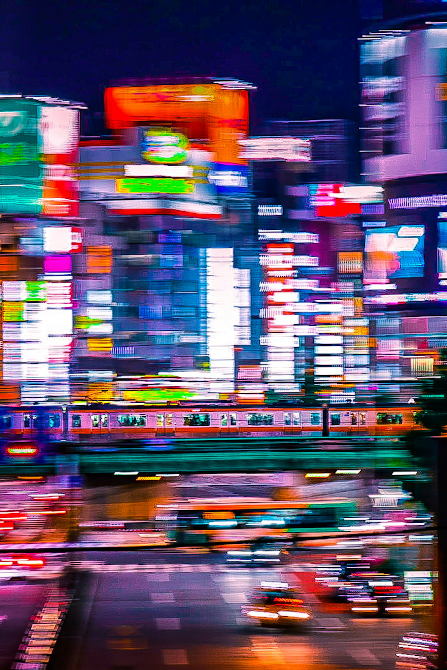 Blurred image of Tokyo nightlife vibrant neon signs and train visible