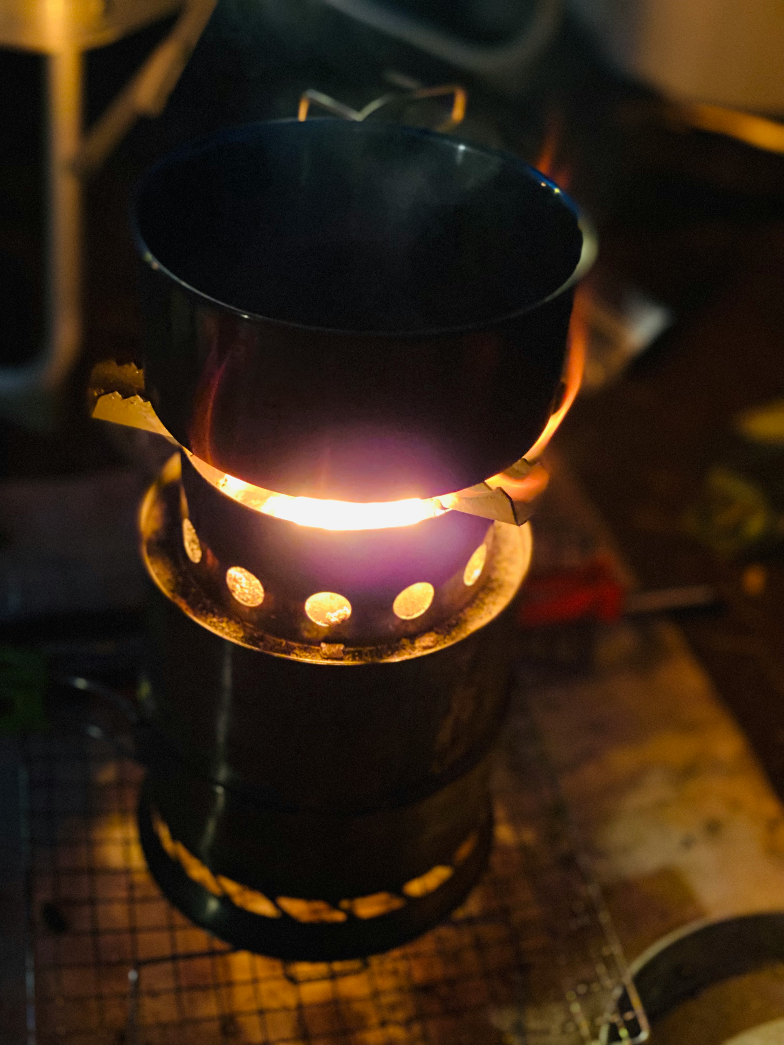 glowing lantern flame in a nighttime outdoor setting