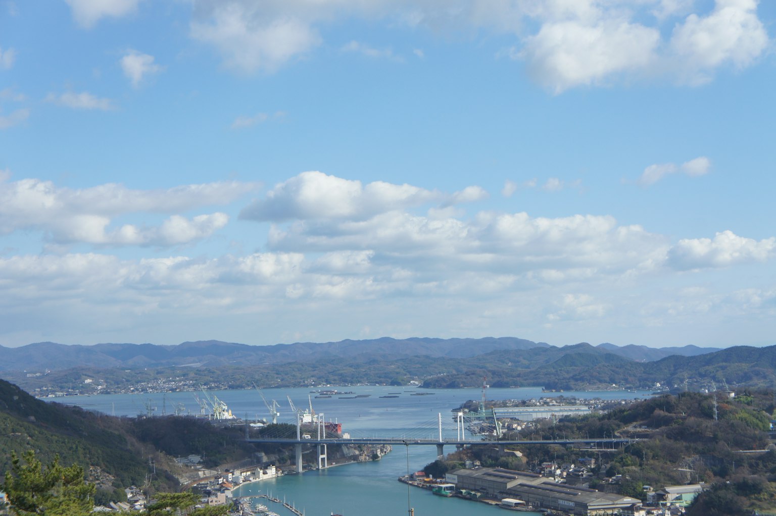Scenic view of a harbor town with clear skies and blue water