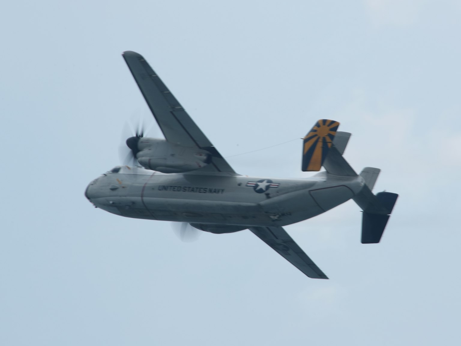 Military aircraft flying in the sky side view propeller plane