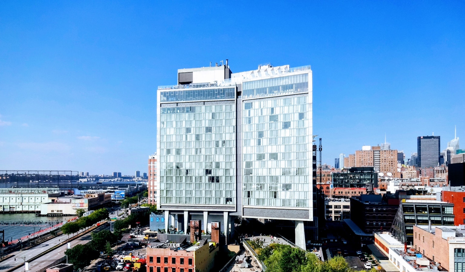 Modern architectural design of a skyscraper under a clear blue sky
