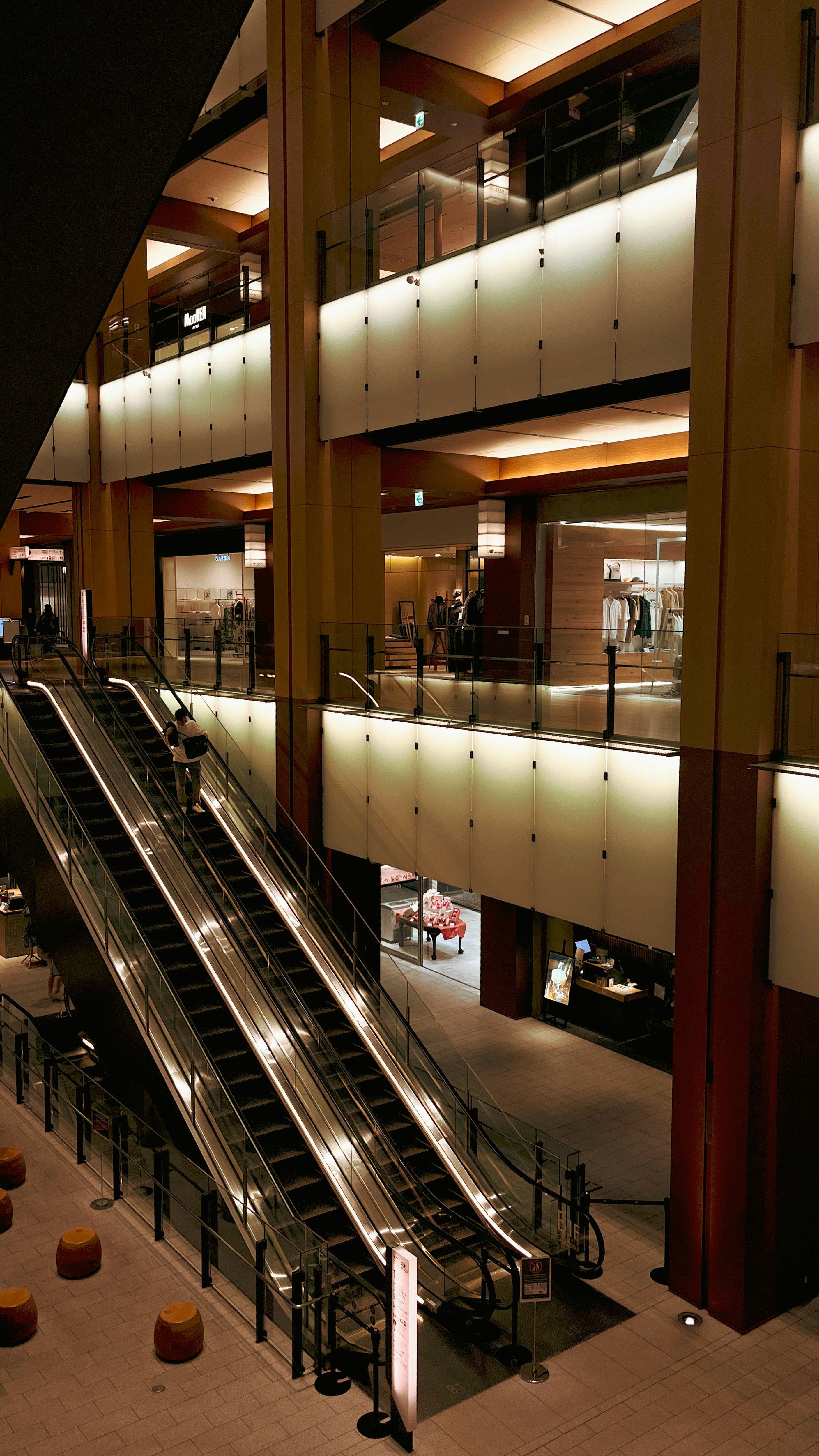 long indoor escalators in a spacious atrium