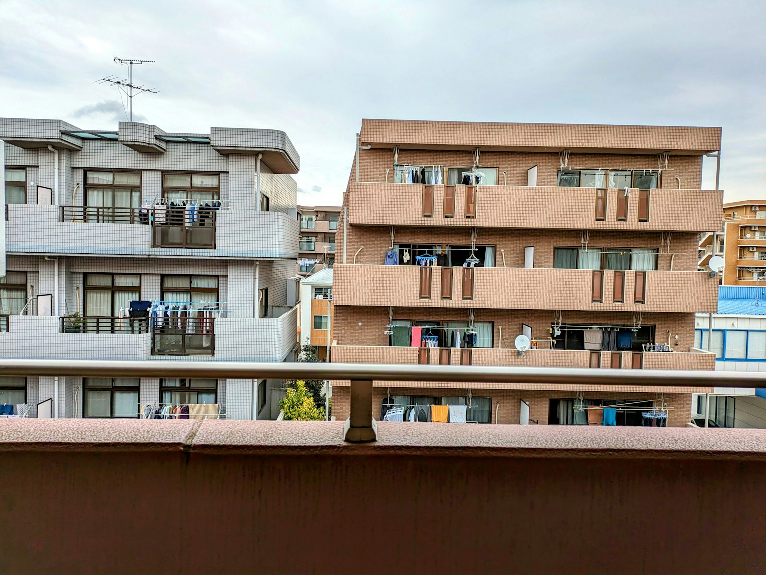 View of apartment buildings with clothes hanging on balconies