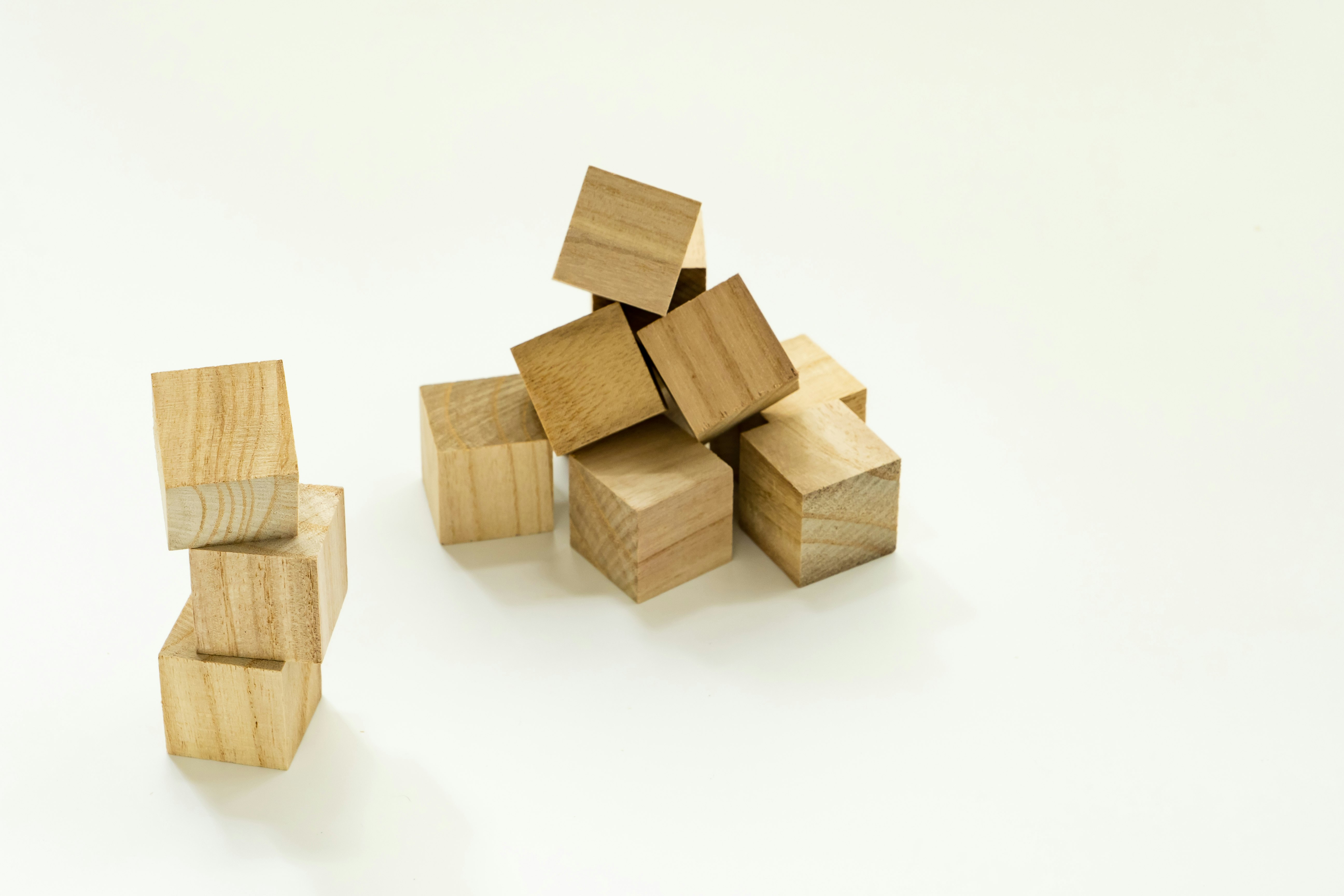 wooden block pieces arranged on a white background