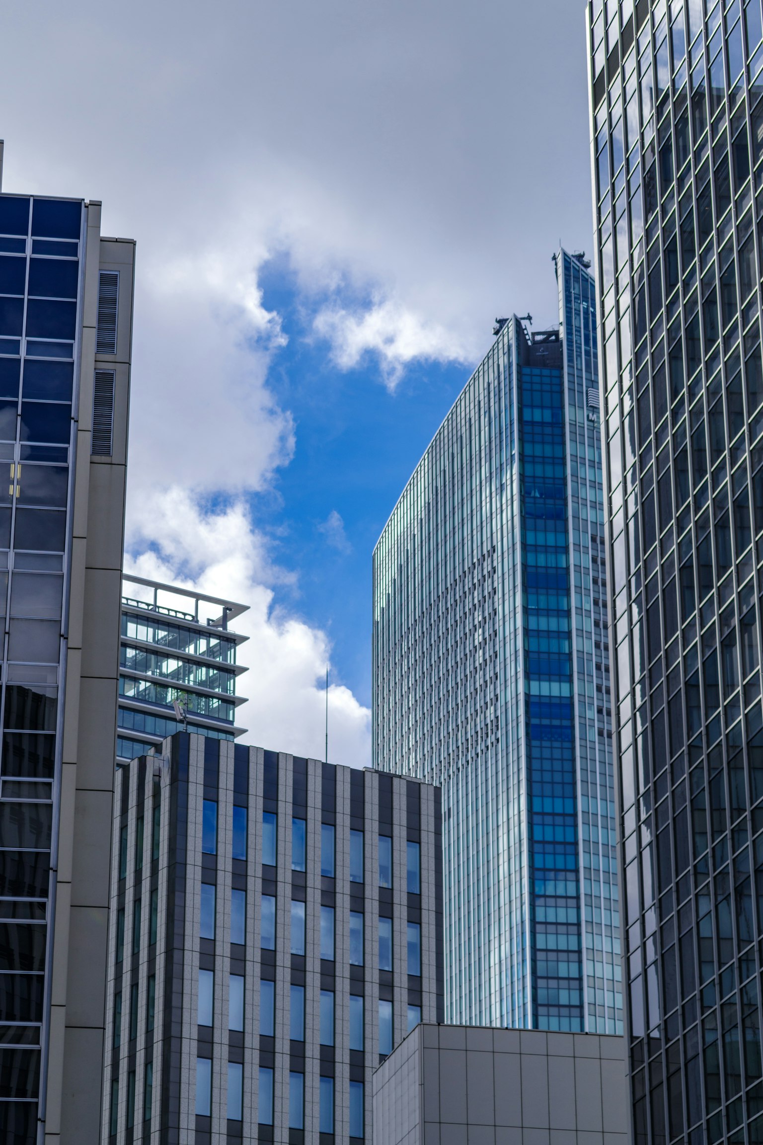 Urban landscape featuring skyscrapers with blue sky