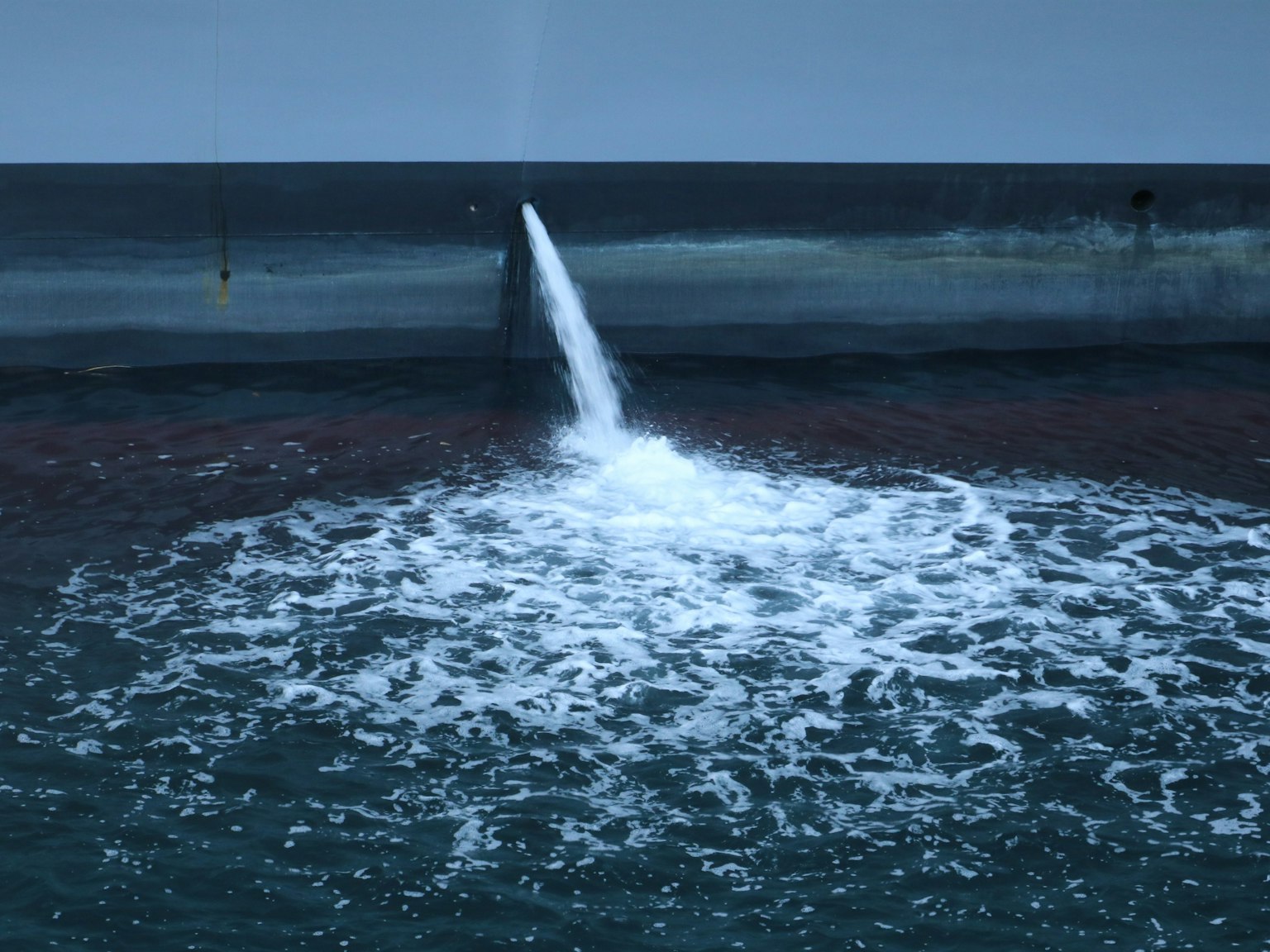 Water jetting from the ocean surface with dark water