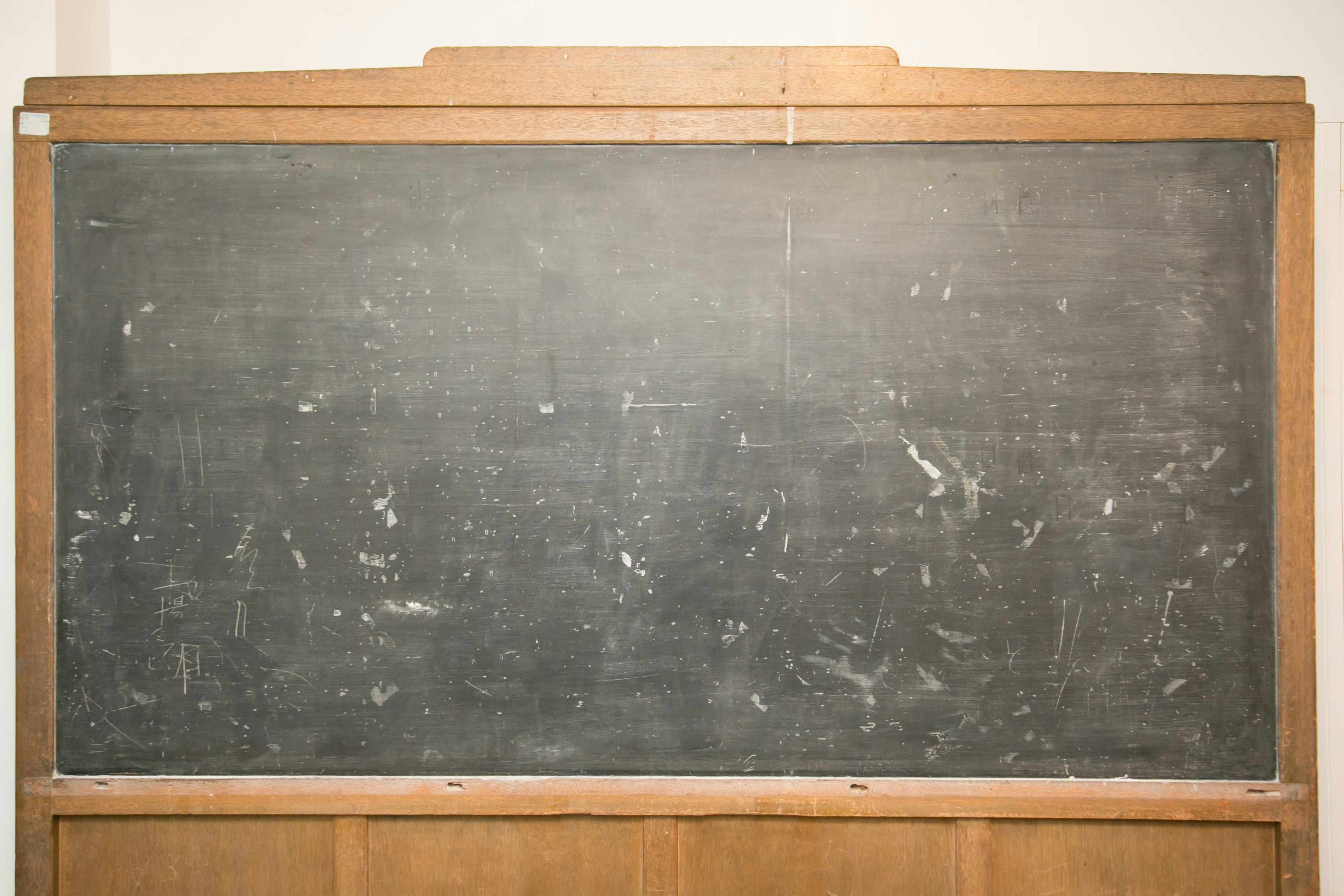 chalkboard with chalk marks in a classroom