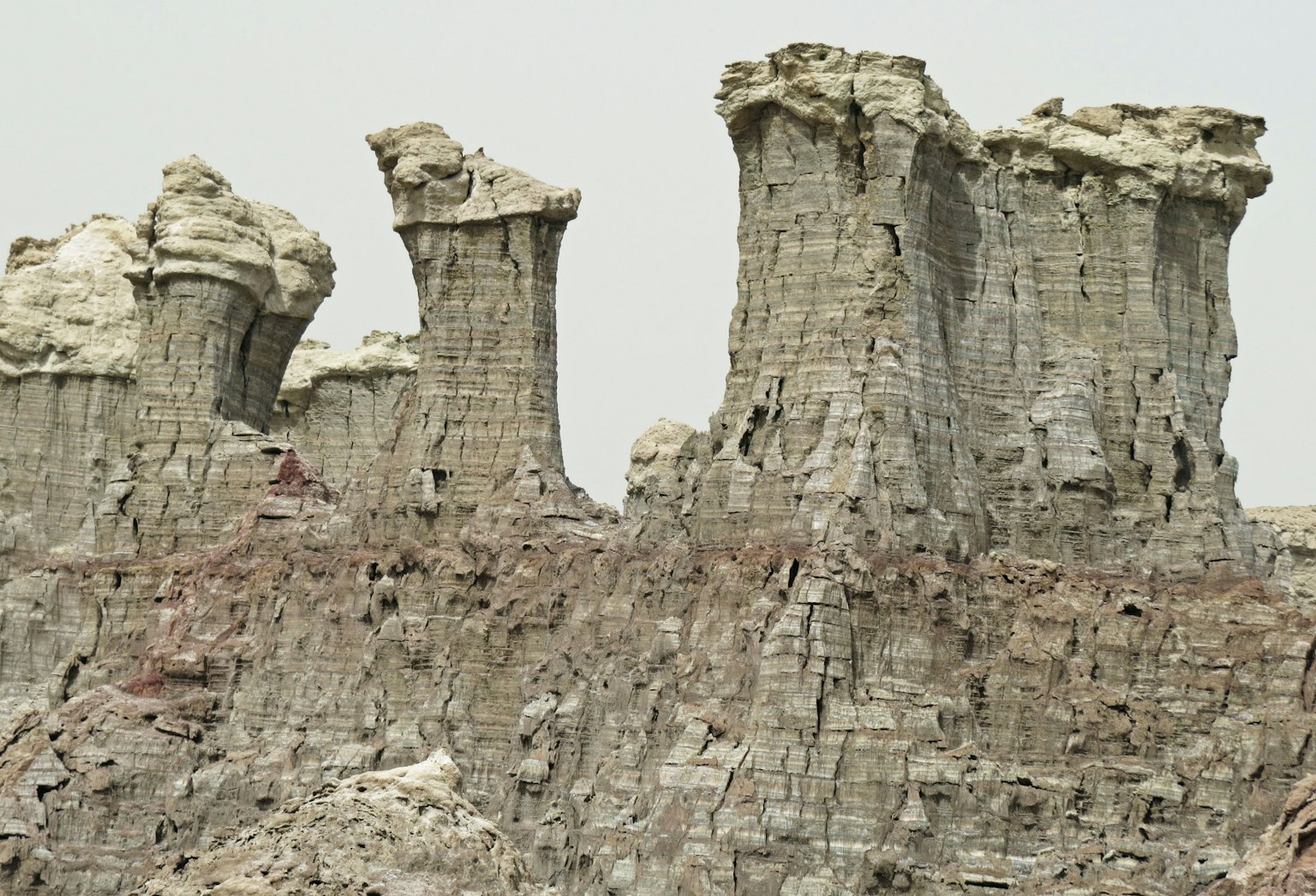 Unique rock formations resembling towers in a barren landscape