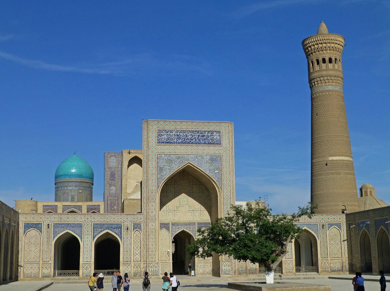 Historic buildings of Uzbekistan with a blue dome mosque and tall minaret