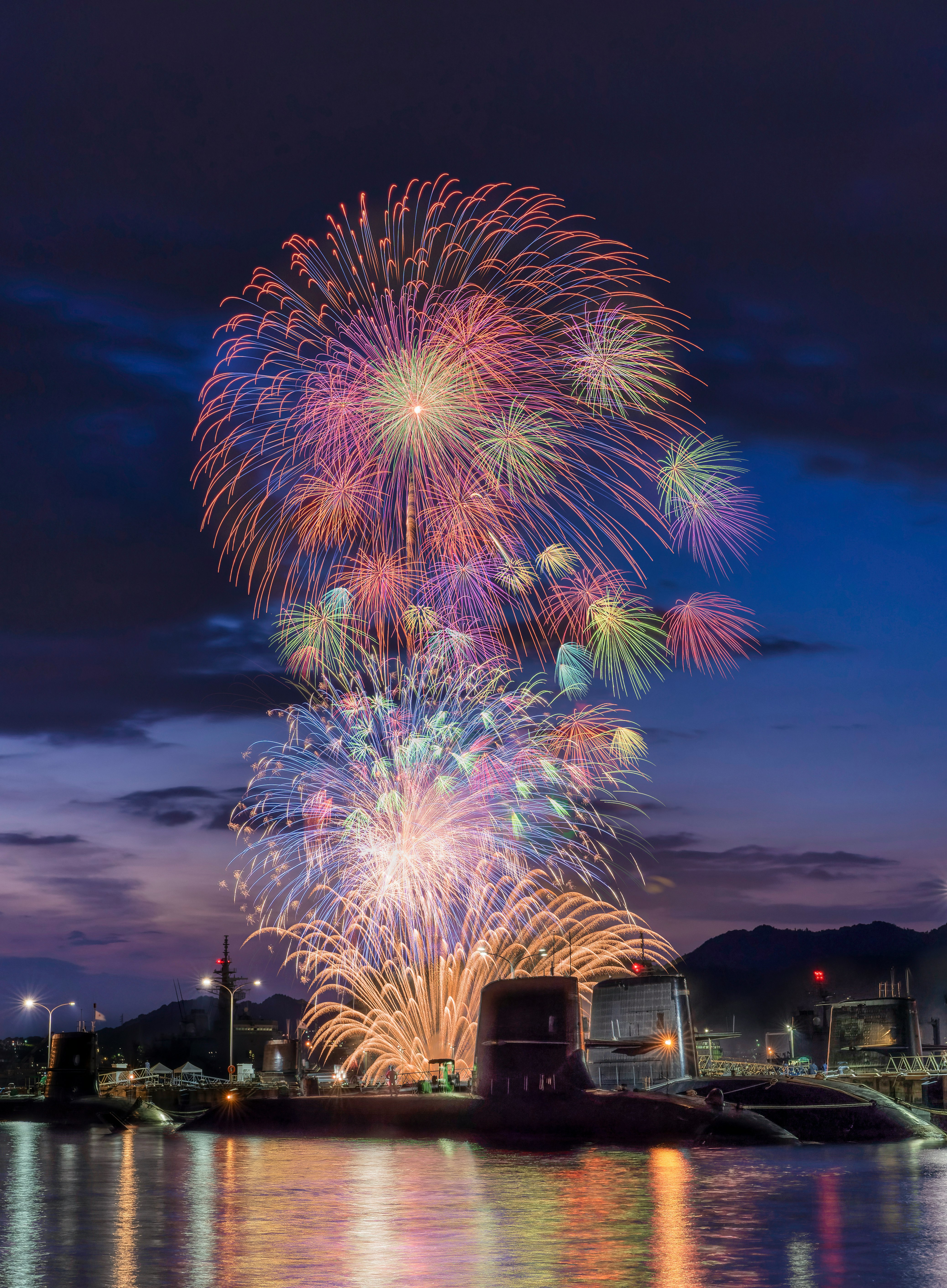 Kure summer festival fireworks over the harbor, colorful fireworks in the night sky image