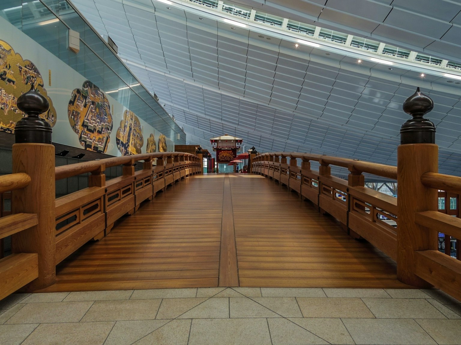 Interior view of a wooden bridge leading to a structure