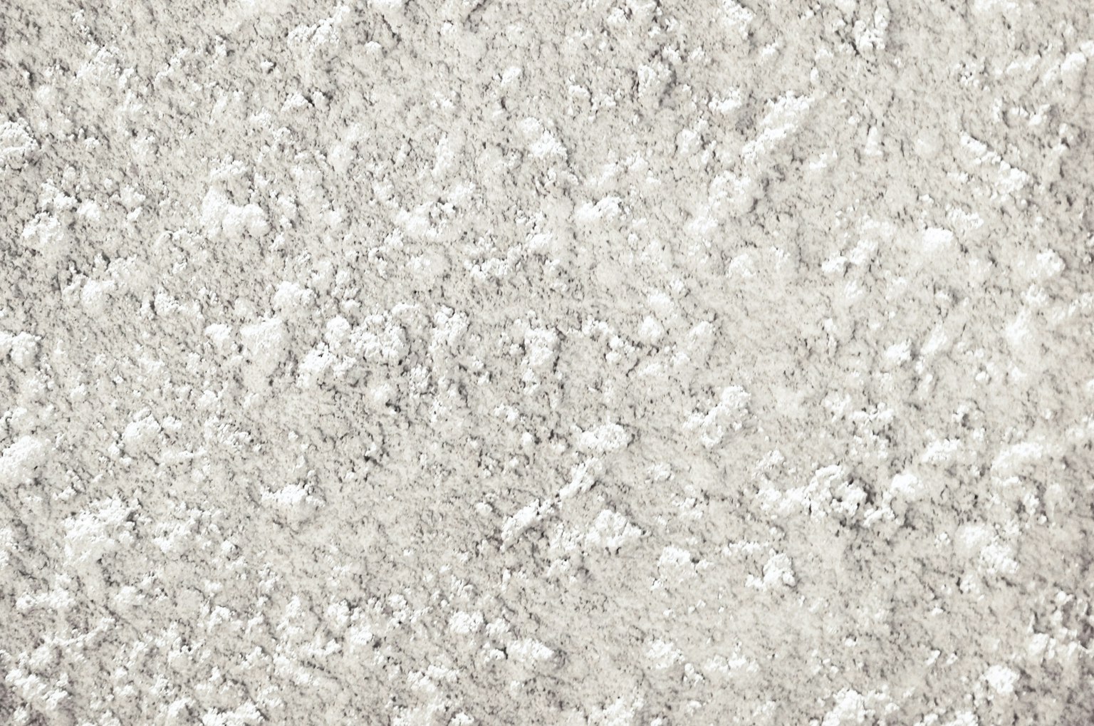 Textura de superficie con partículas blancas dispersas