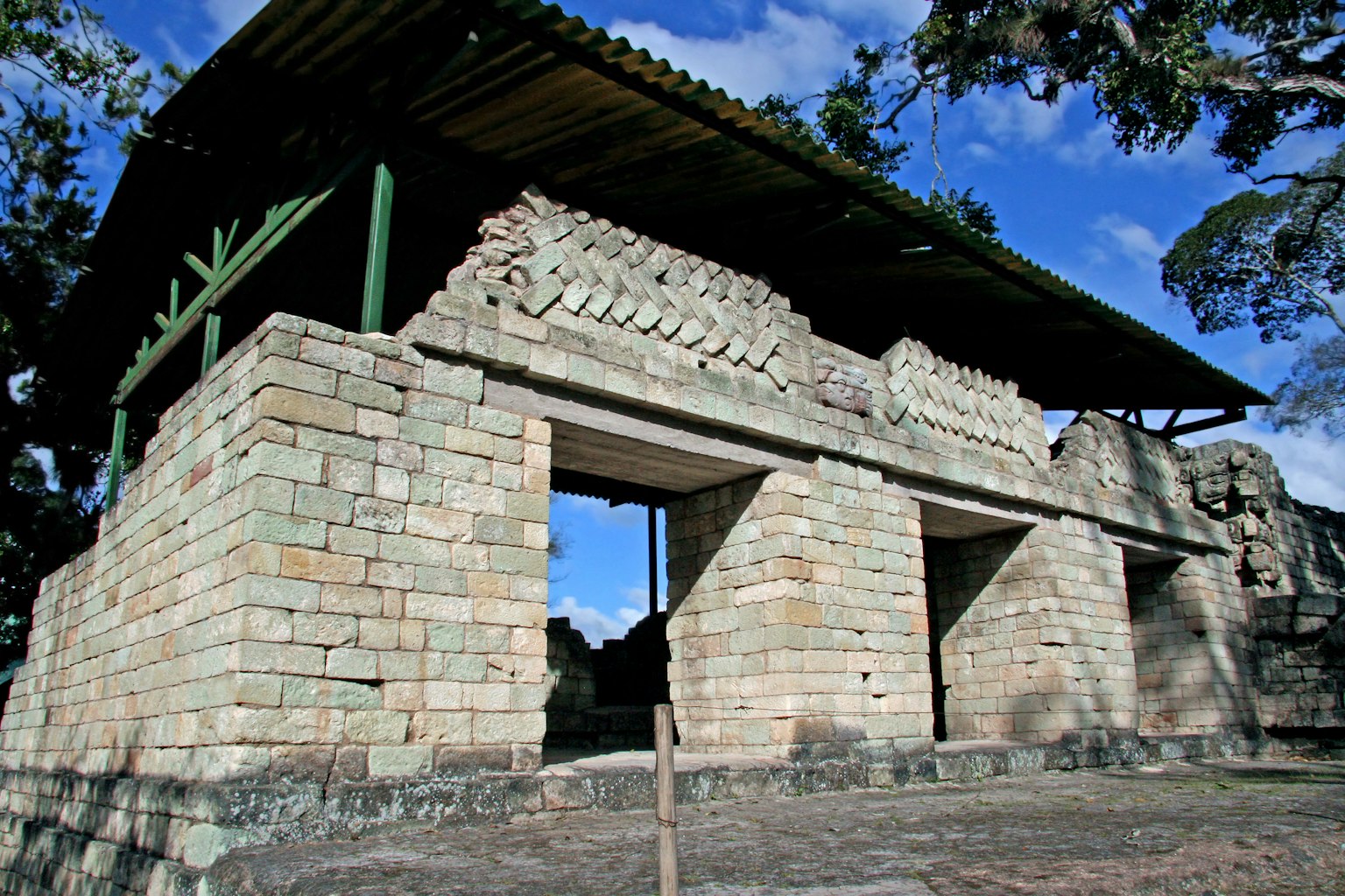 Ancient stone structure ruins under a blue sky