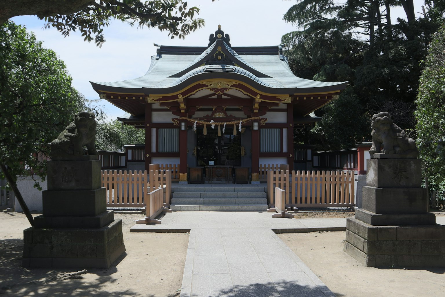 A shrine building with a beautiful roof and ornate details