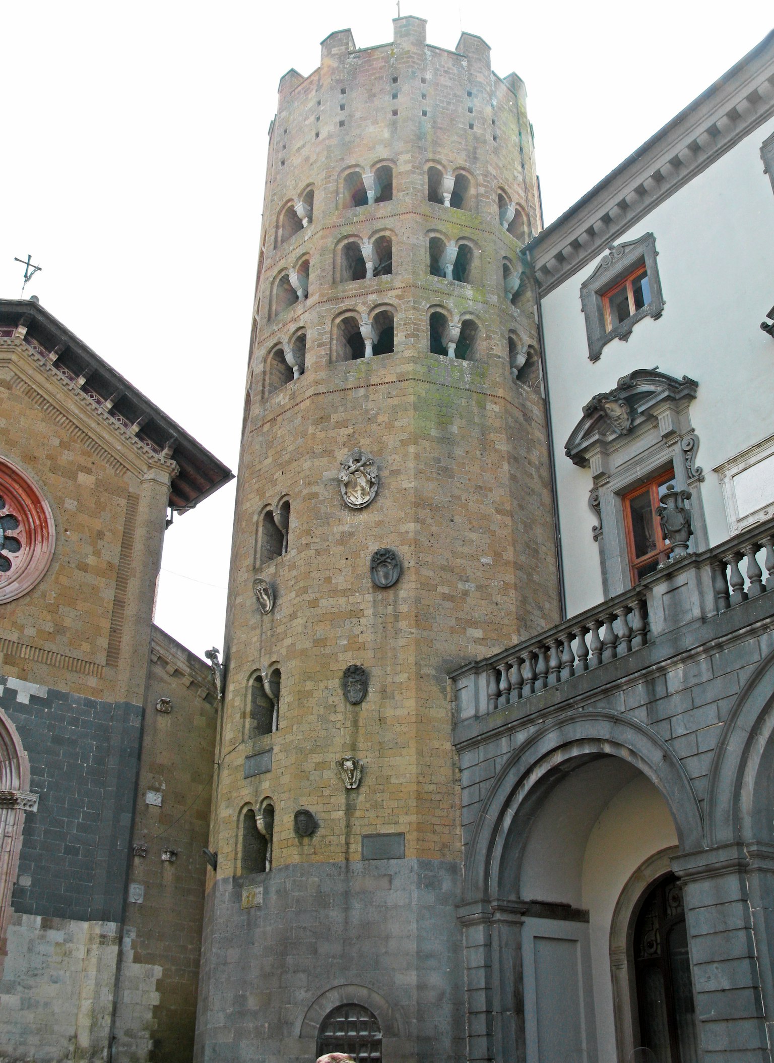 Historic tower with surrounding buildings
