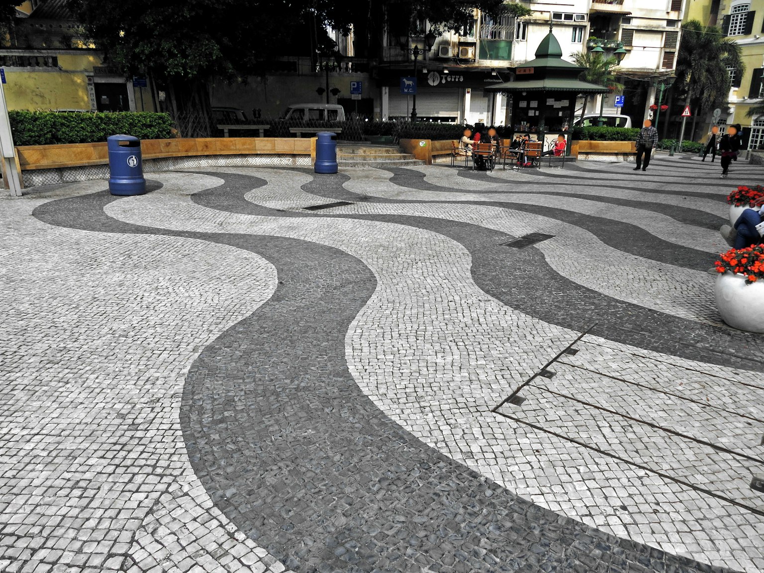 A plaza featuring wavy patterned stone pavement