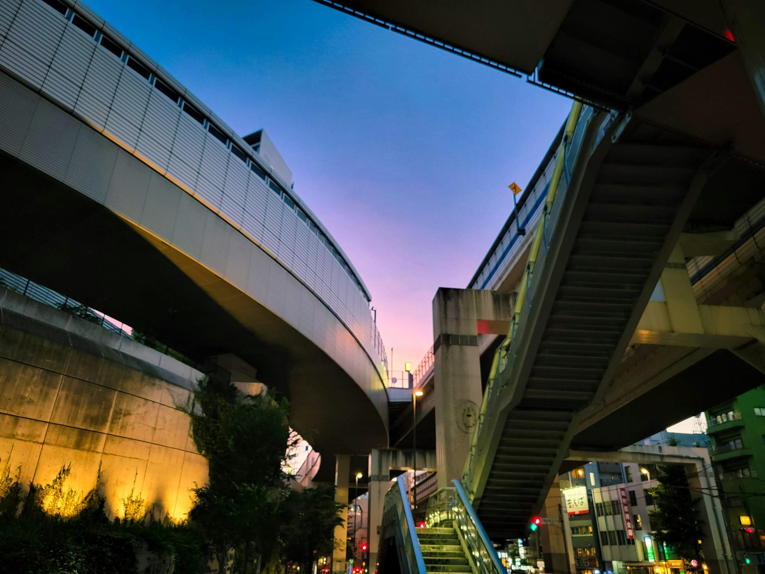 Urban landscape with intersecting elevated roads and stairs