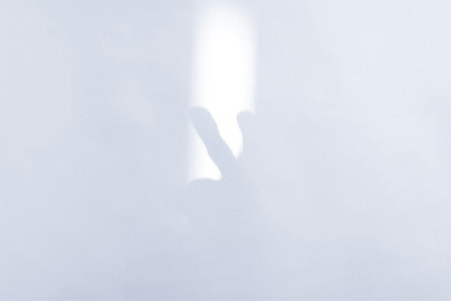 A hand silhouette against a white background
