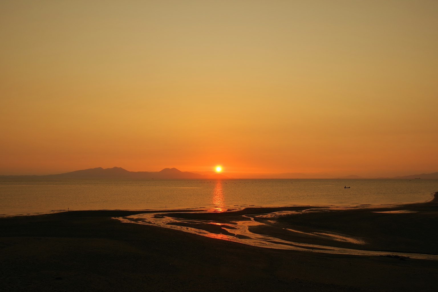 Beautiful landscape of sunset over the sea with orange and yellow gradient