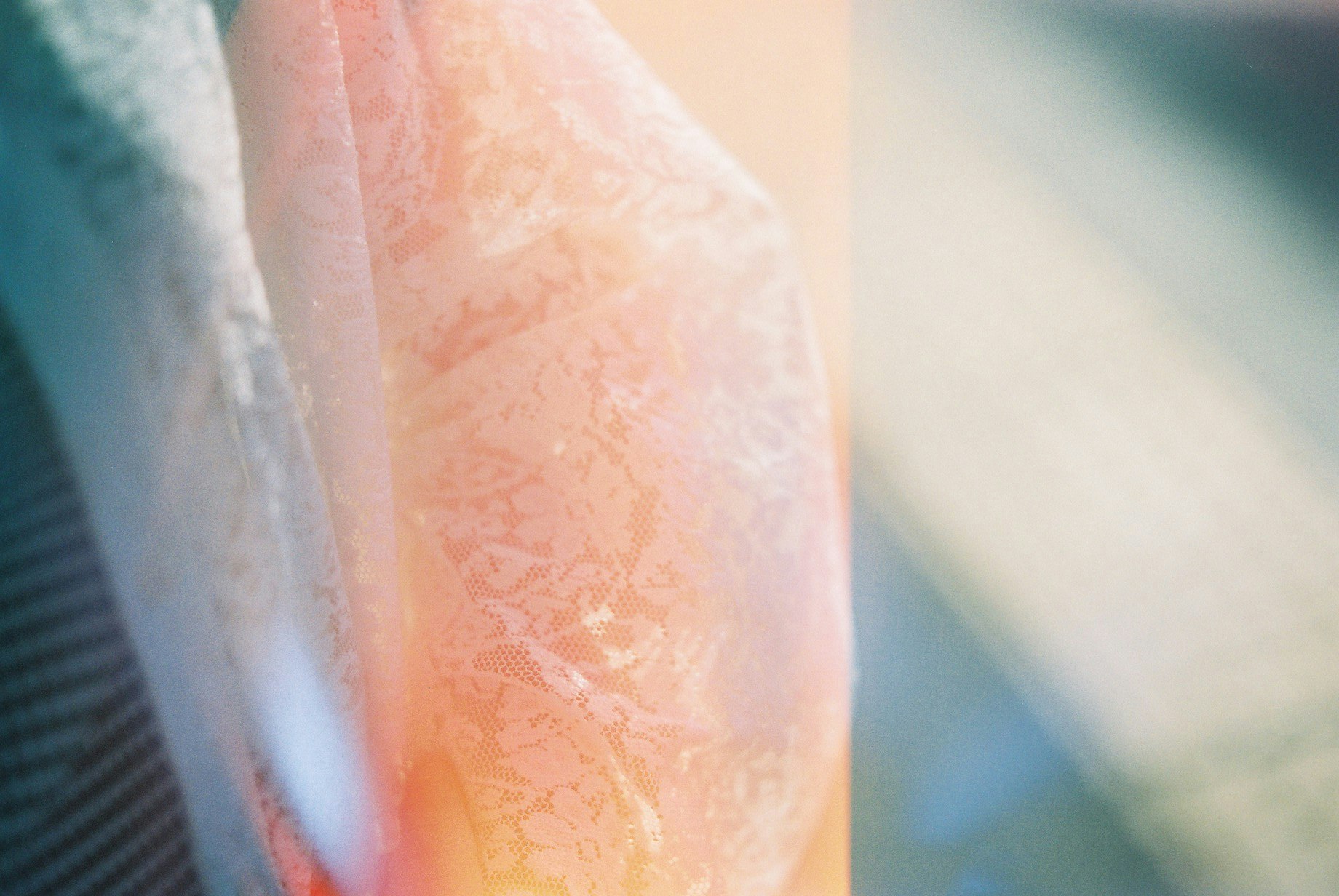 close-up of a transparent container filled with orange liquid