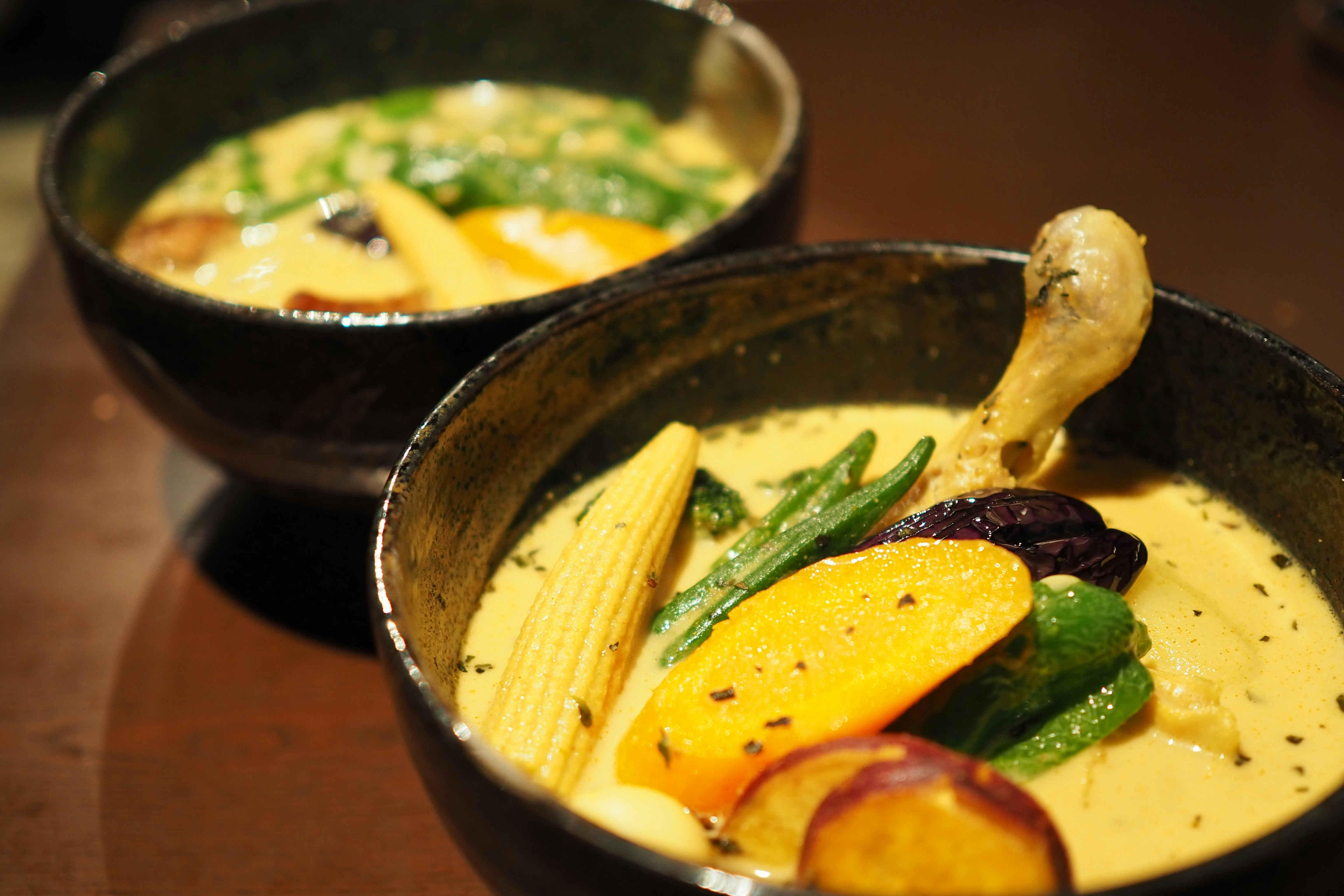 Creamy vegetable soup bowls with beans