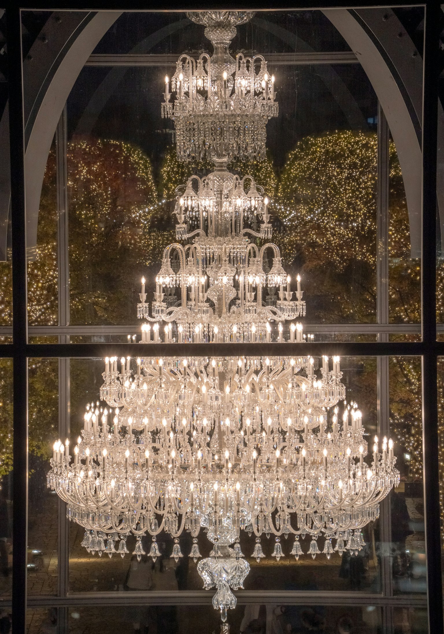 A stunning crystal chandelier sparkling through a window