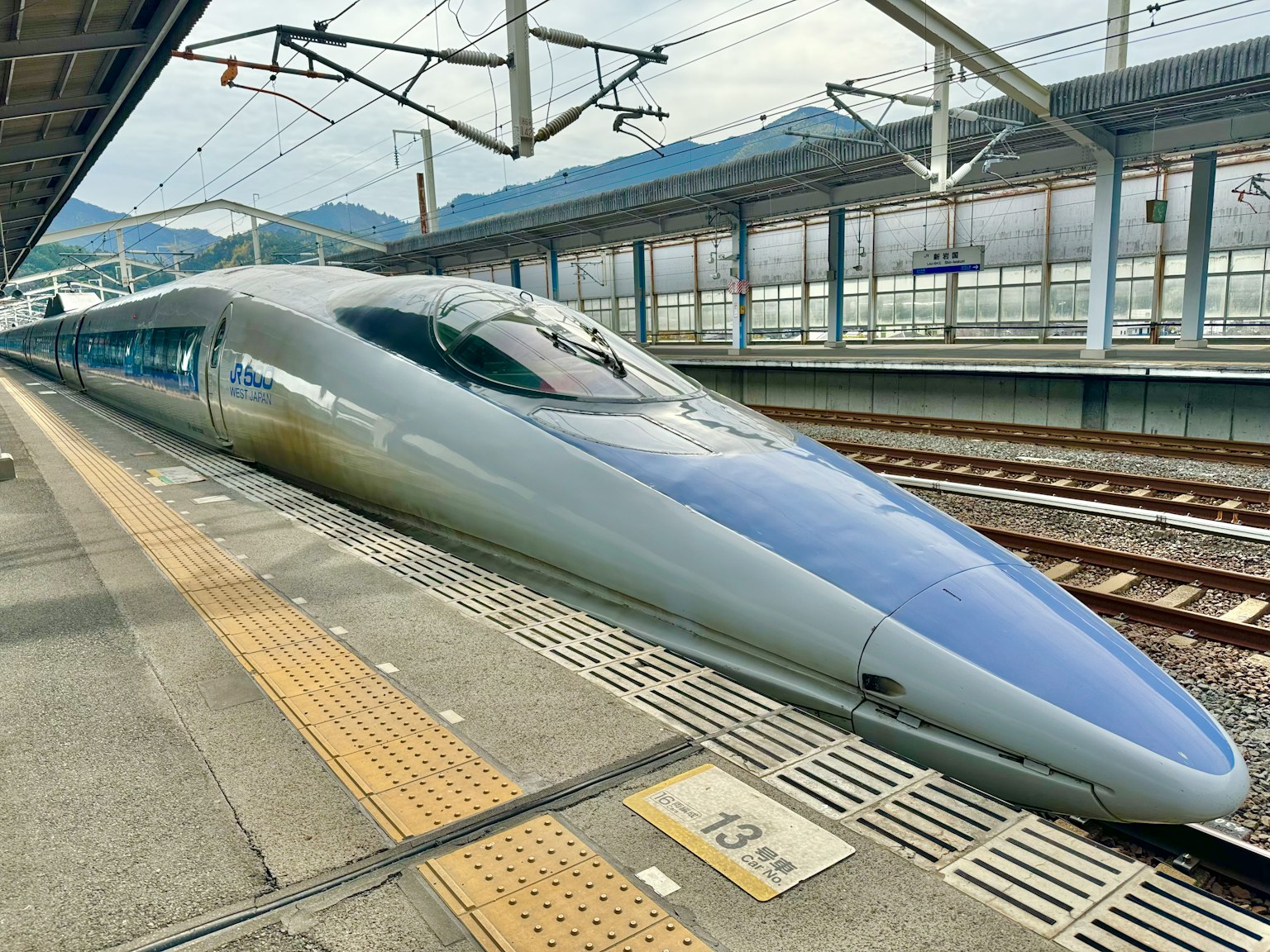 Shinkansen bullet train at the station platform with a sleek design