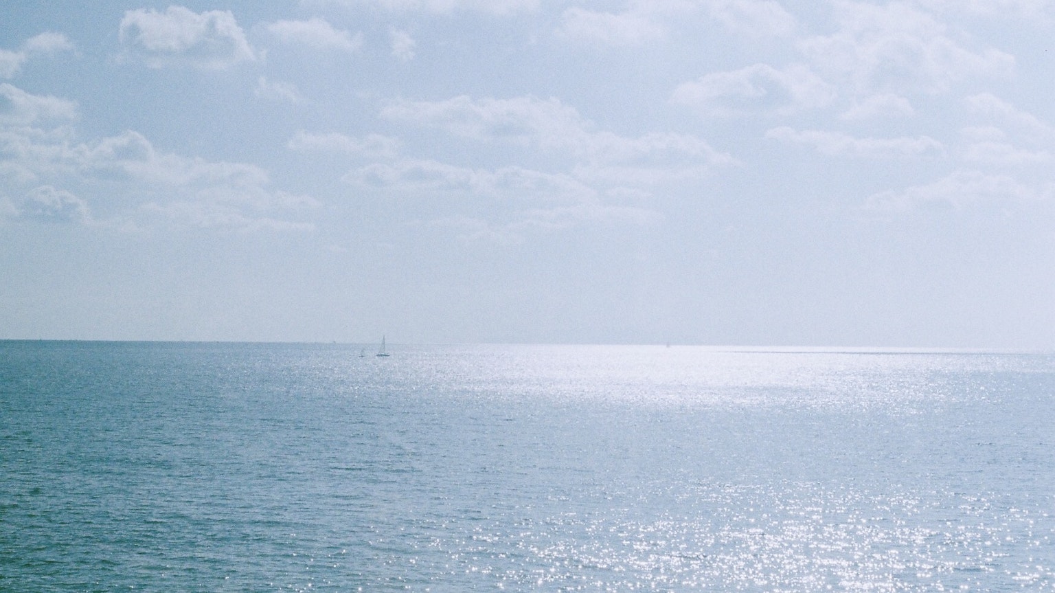 Serene ocean view with a bright sky