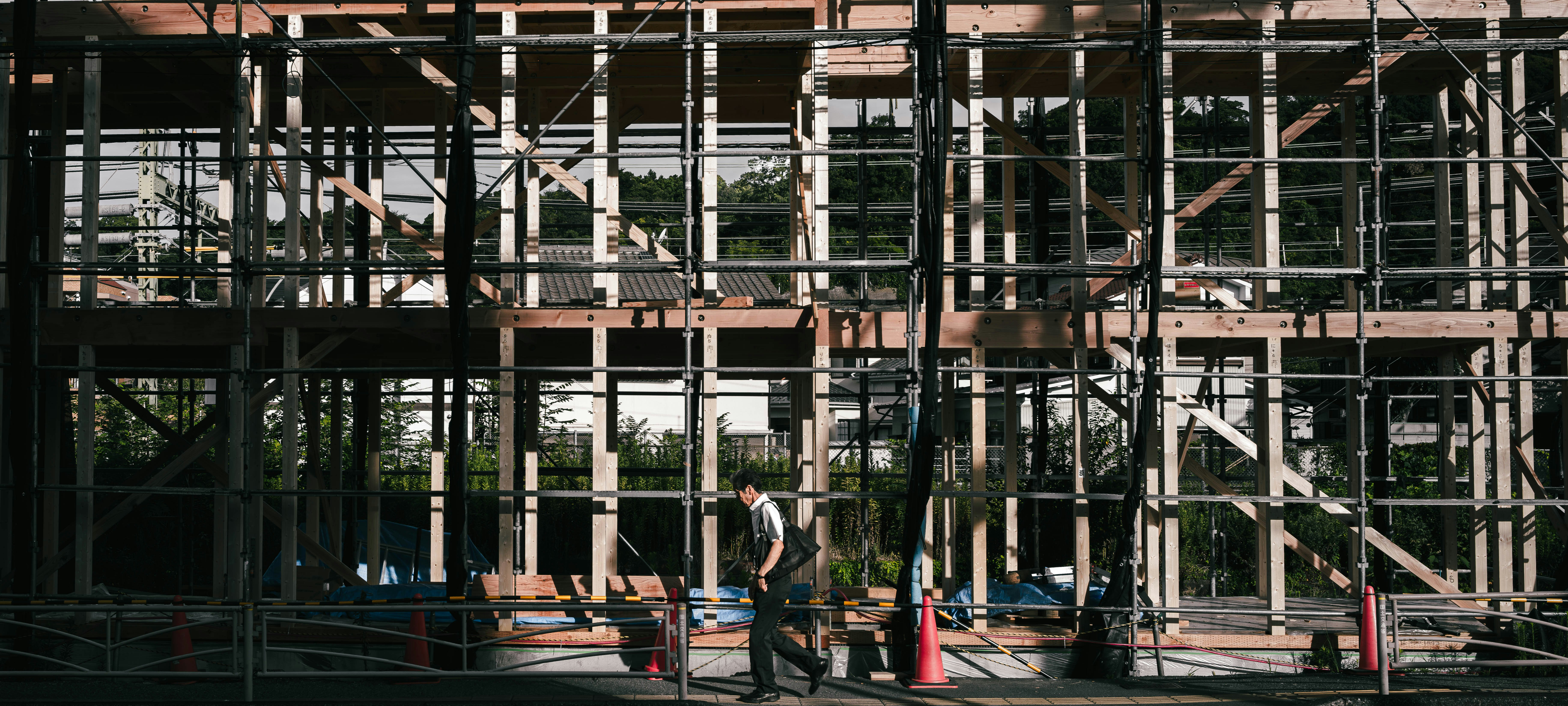 construction site with steel framework and workers