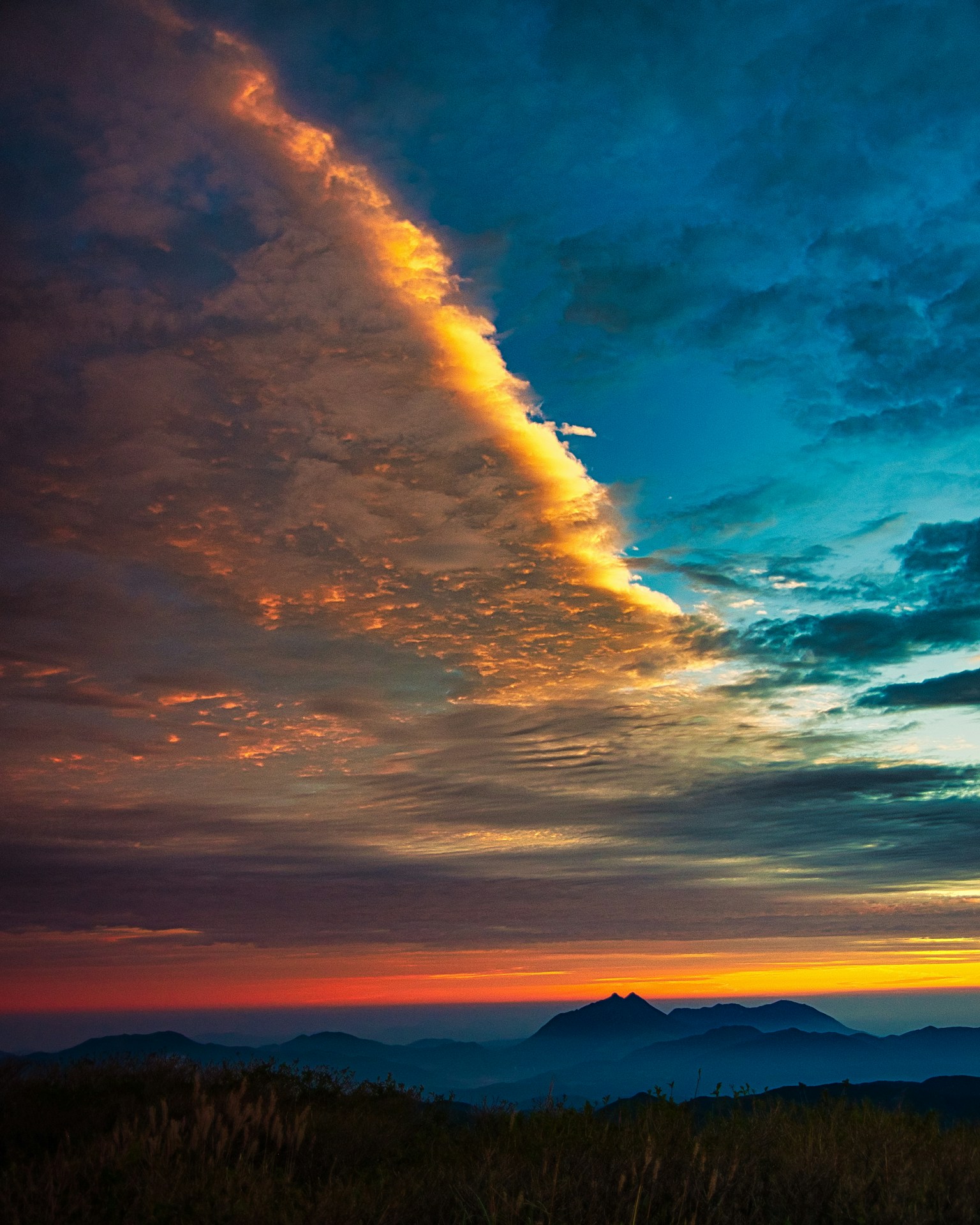 Stunning sunset sky with mountains in the background