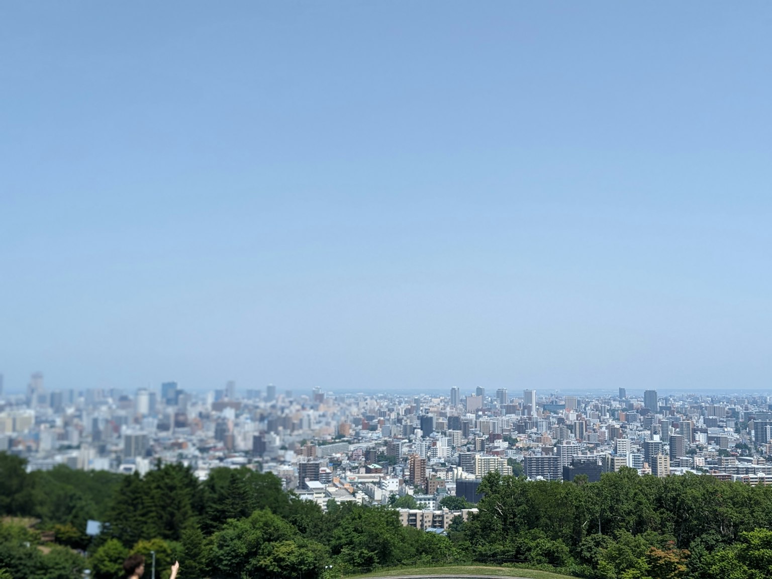 Expansive cityscape under a clear blue sky
