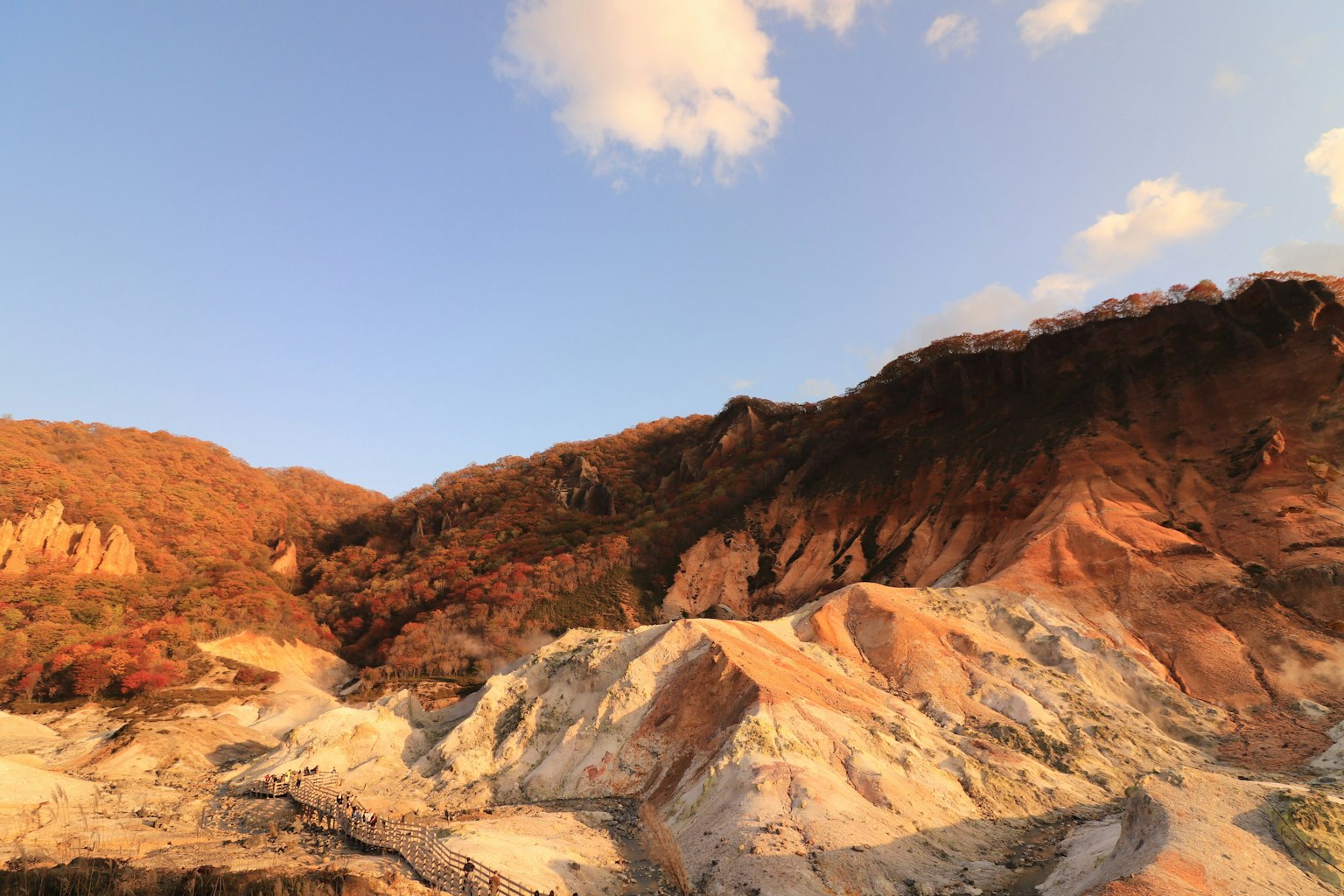 Beautiful landscape of autumn-colored mountains with a blue sky