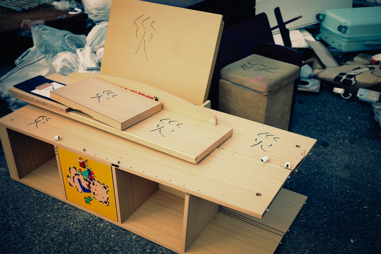 Scene with scattered wooden furniture pieces